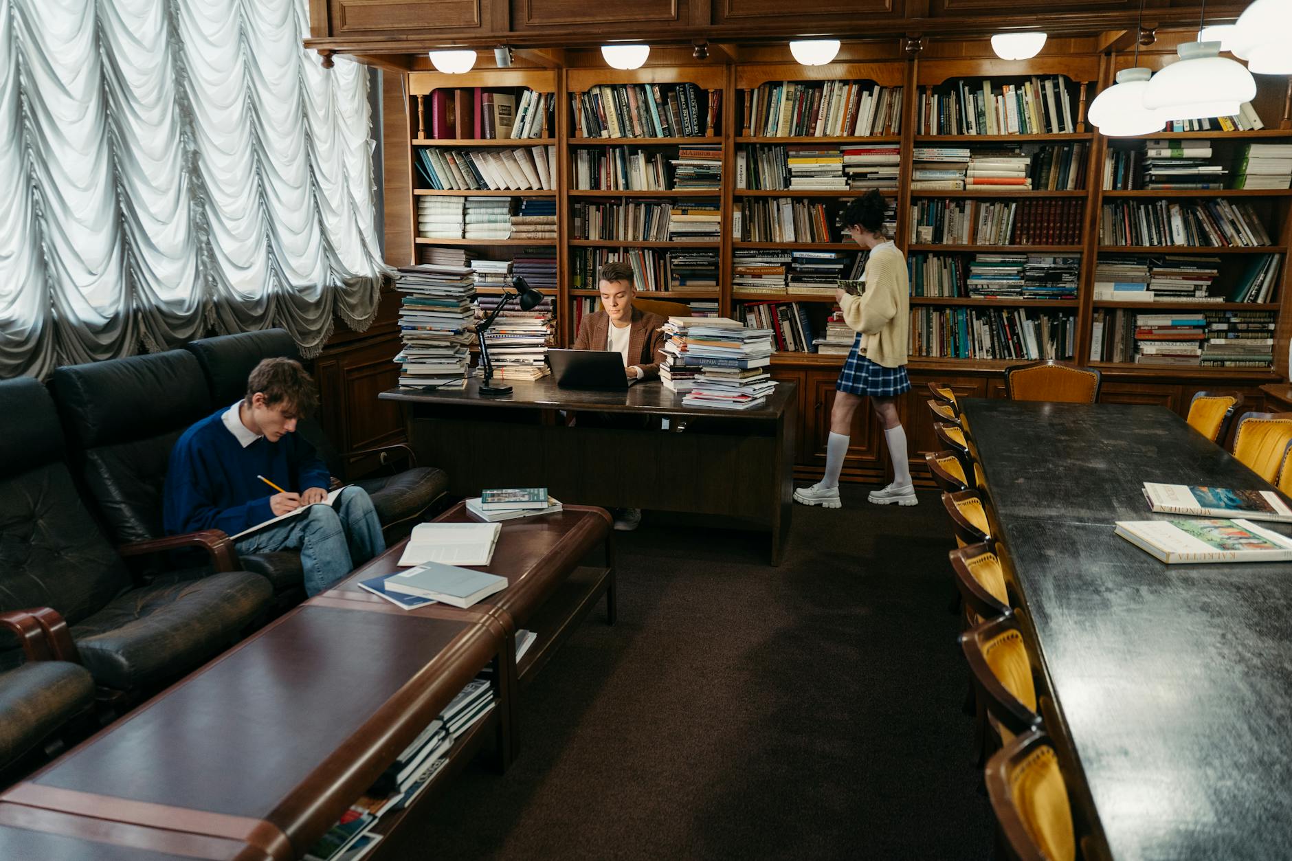 Students engaging in study and research within a classic library setting — UPI Study