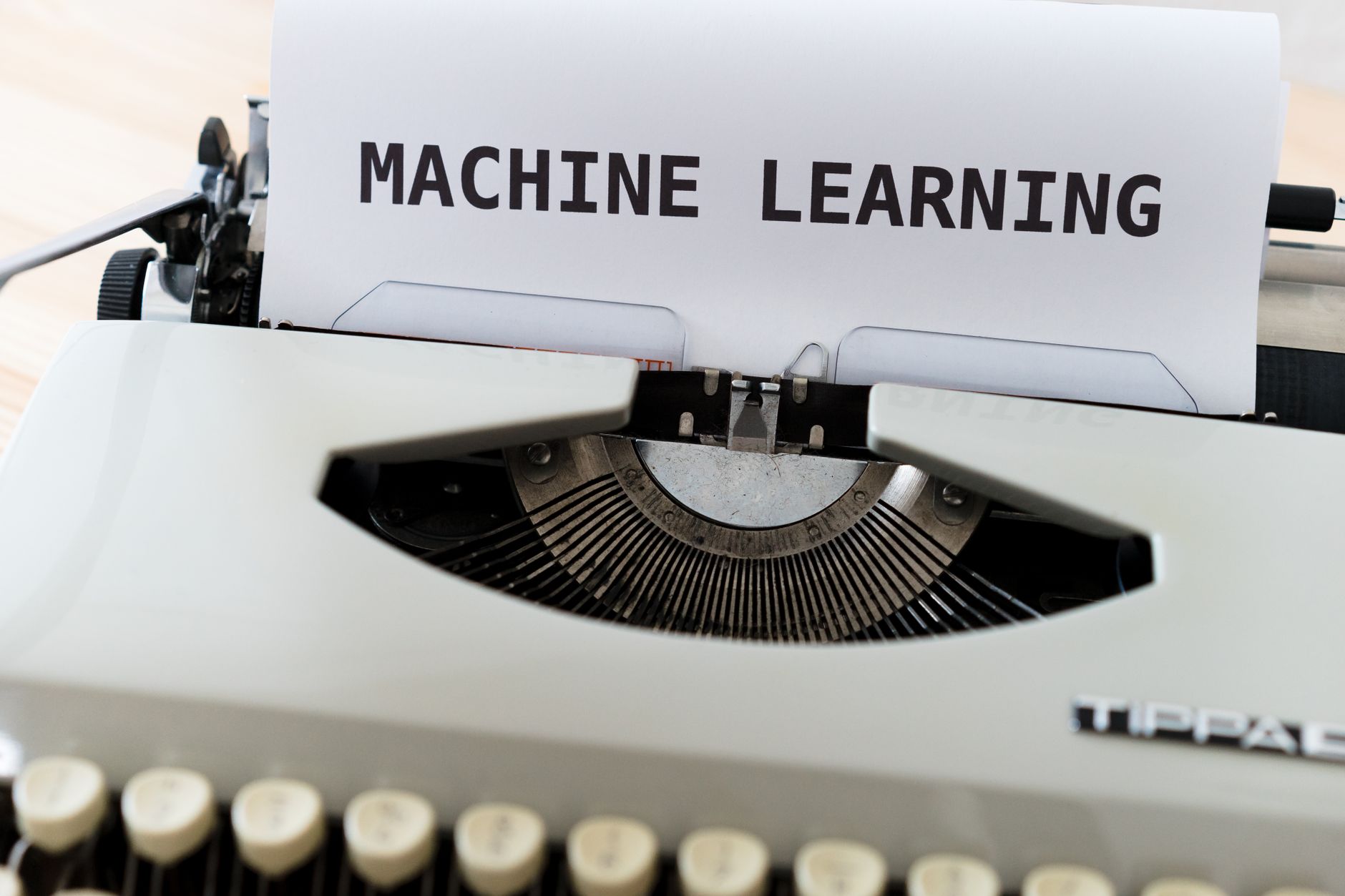 Vintage typewriter displaying 'Machine Learning' text, blending old and new concepts — UPI Study