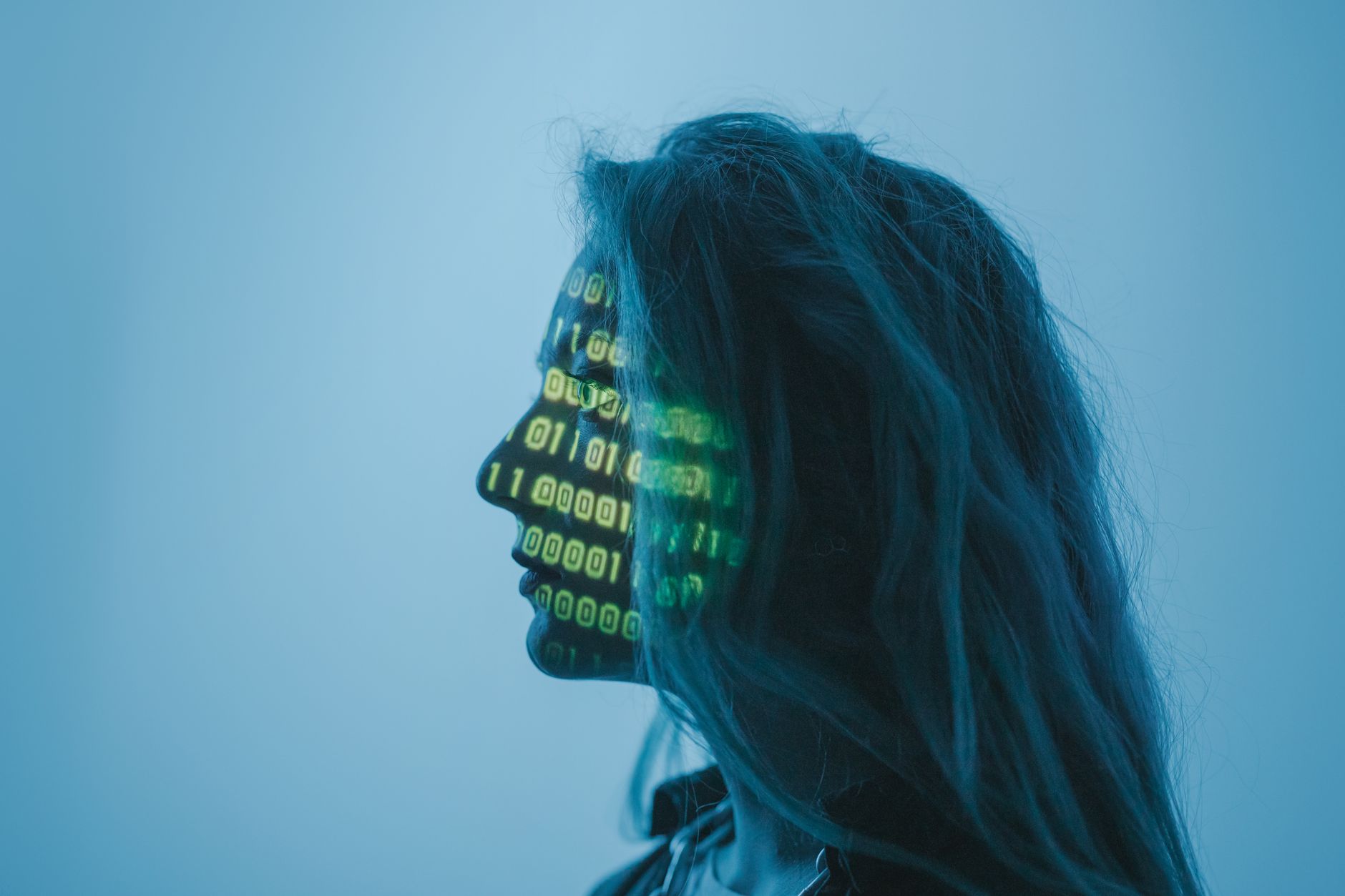 Silhouette of a woman with binary code projected on her face in a digital concept setting — UPI Study
