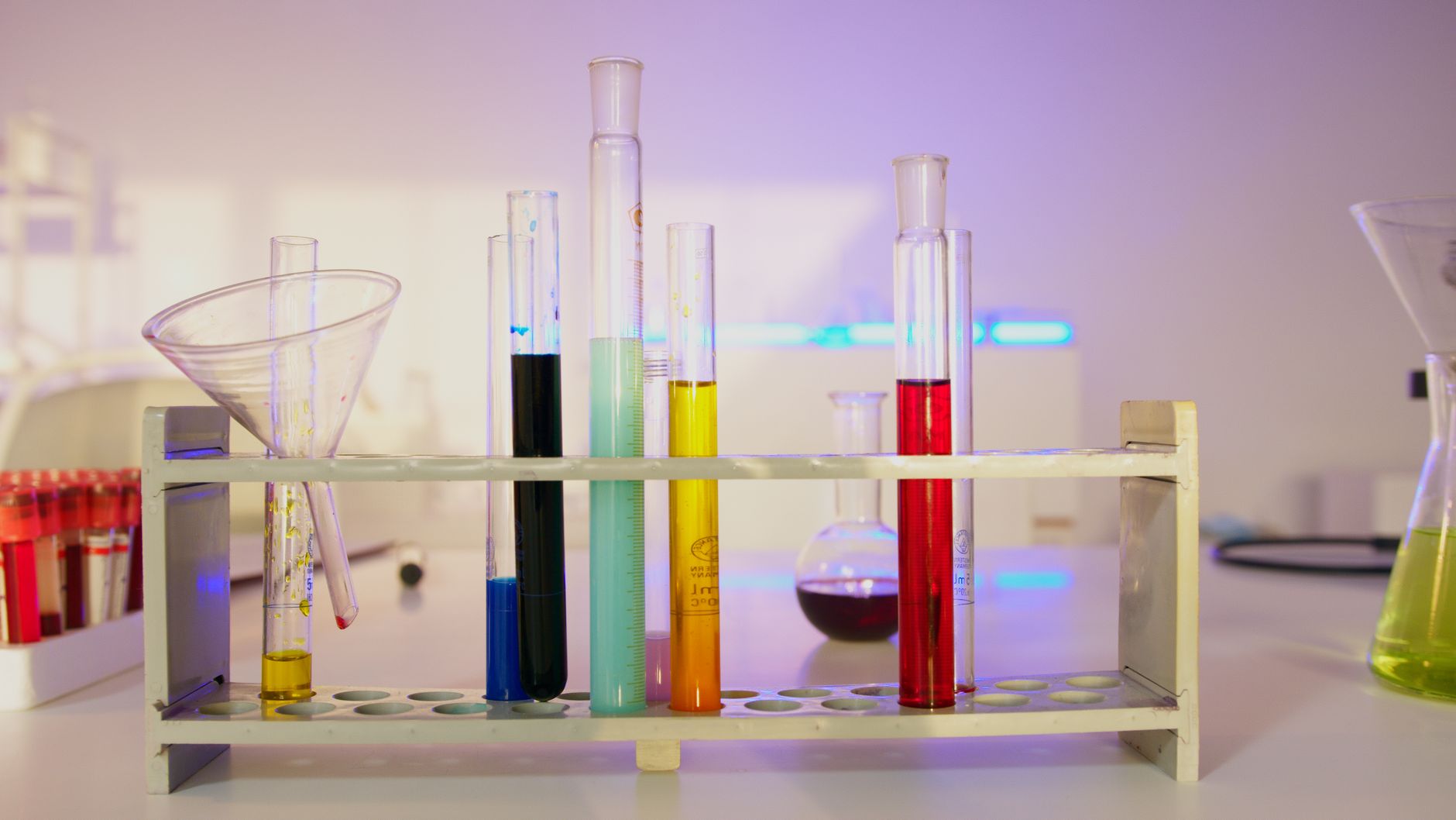 Vibrant test tubes filled with liquids in a modern lab setting, showcasing scientific exploration — UPI Study