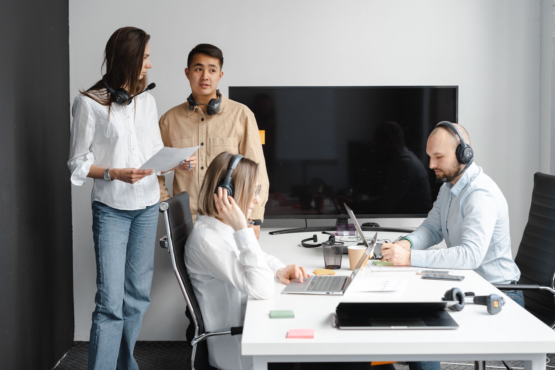Group of call center agents working together in a modern office setting — UPI Study