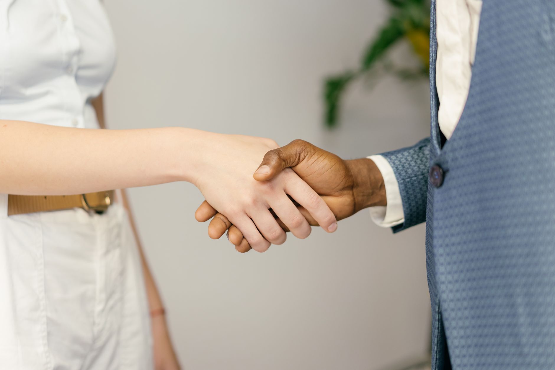 Close-up of a professional handshake symbolizing agreement and partnership in business — UPI Study