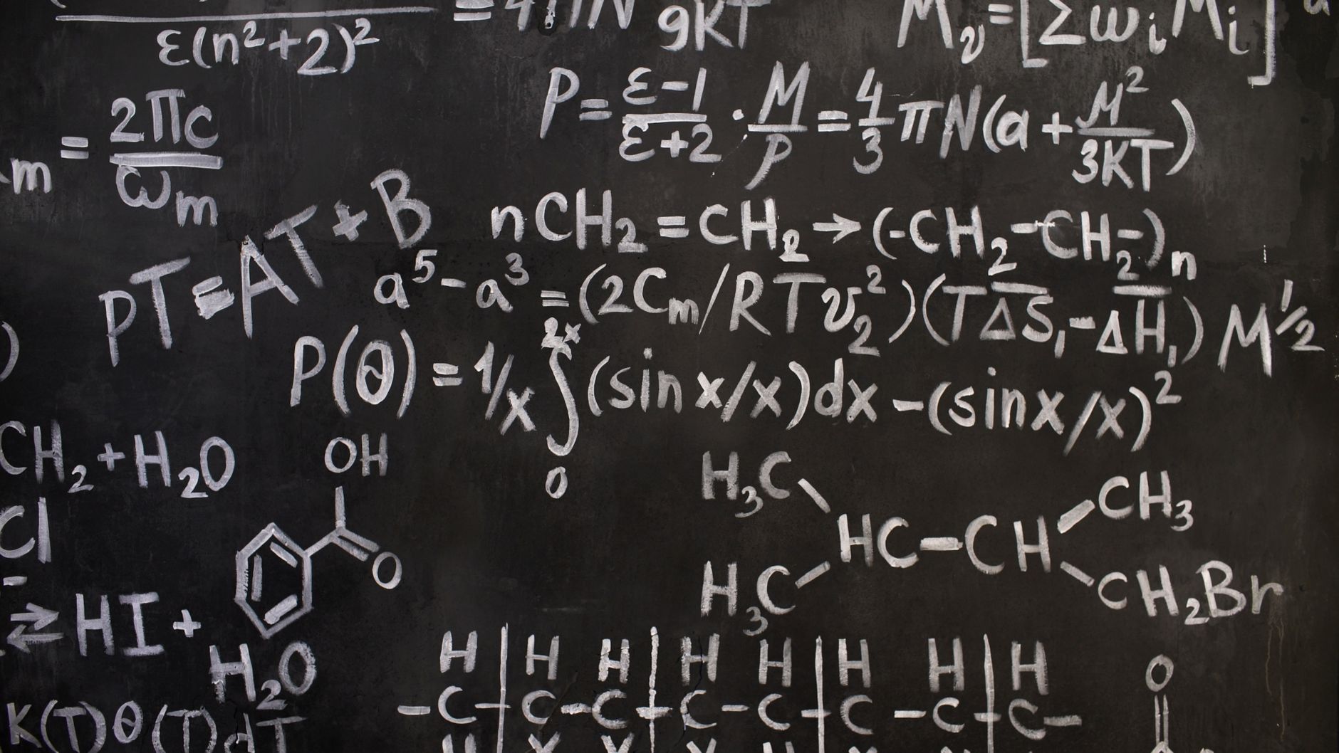 A close-up view of complex mathematical and chemical formulas on a blackboard — UPI Study