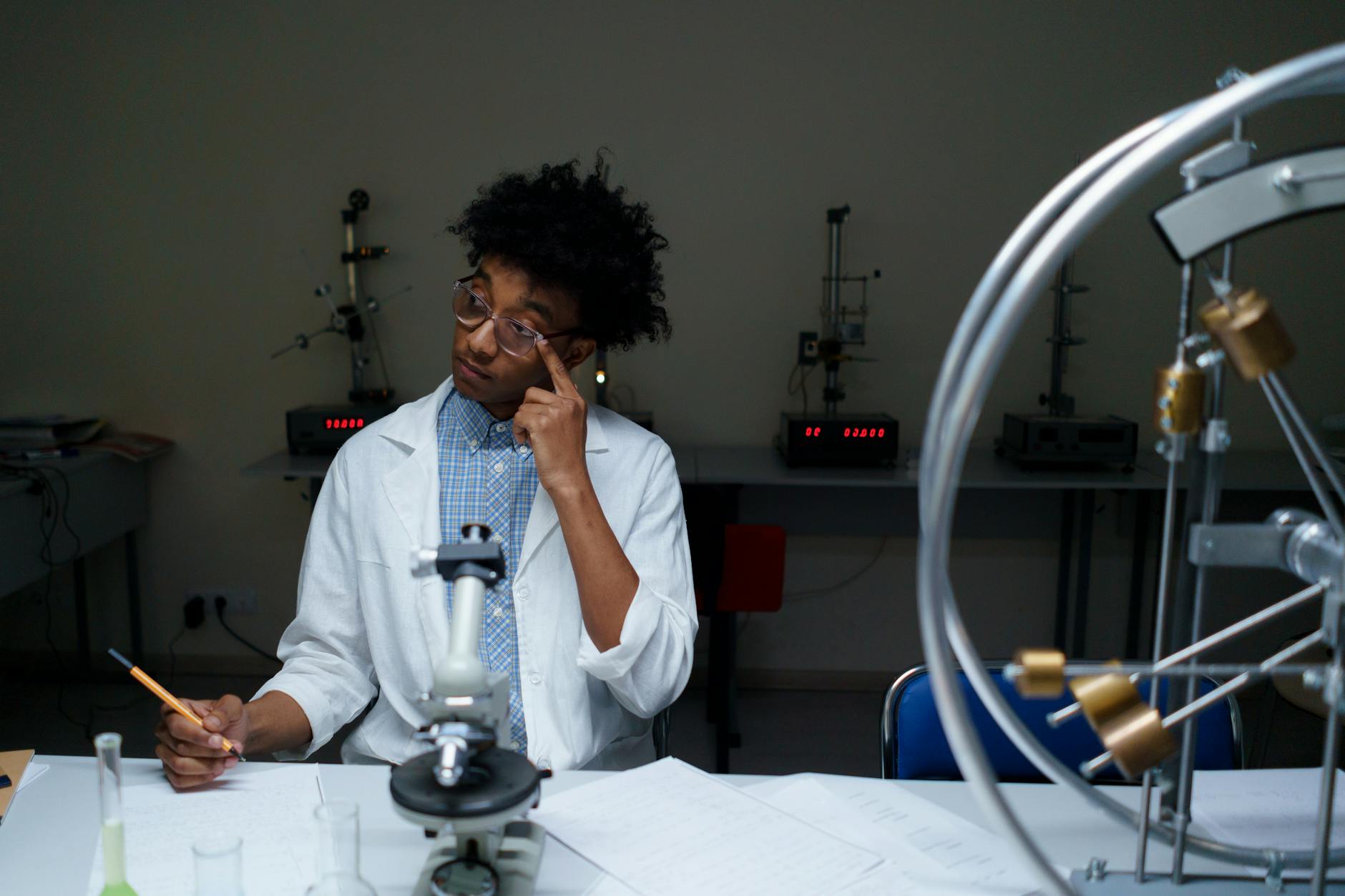 A young adult conducting scientific research in a modern laboratory setting — UPI Study