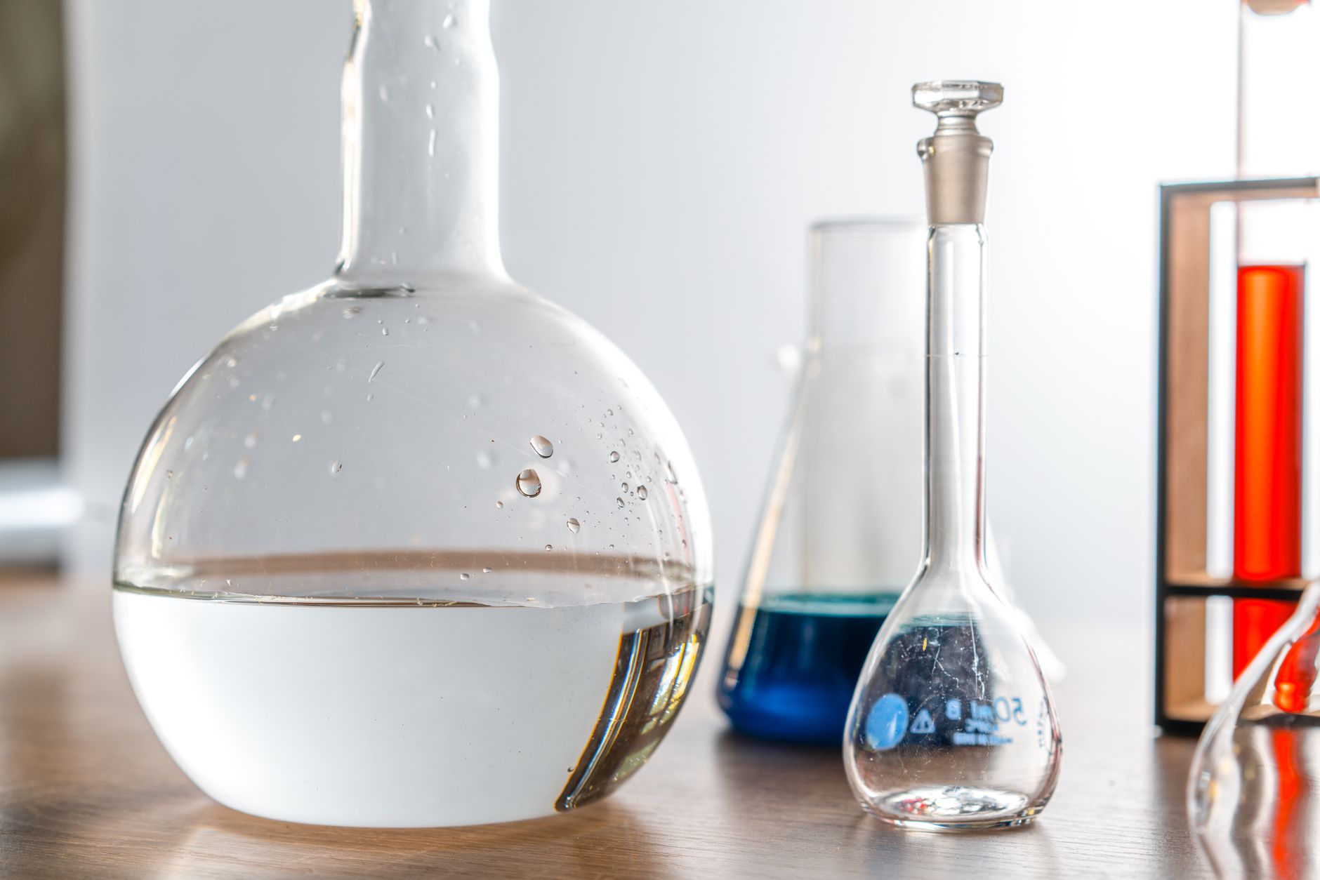 Close-up of laboratory glassware with various chemical solutions in a lab setting — UPI Study