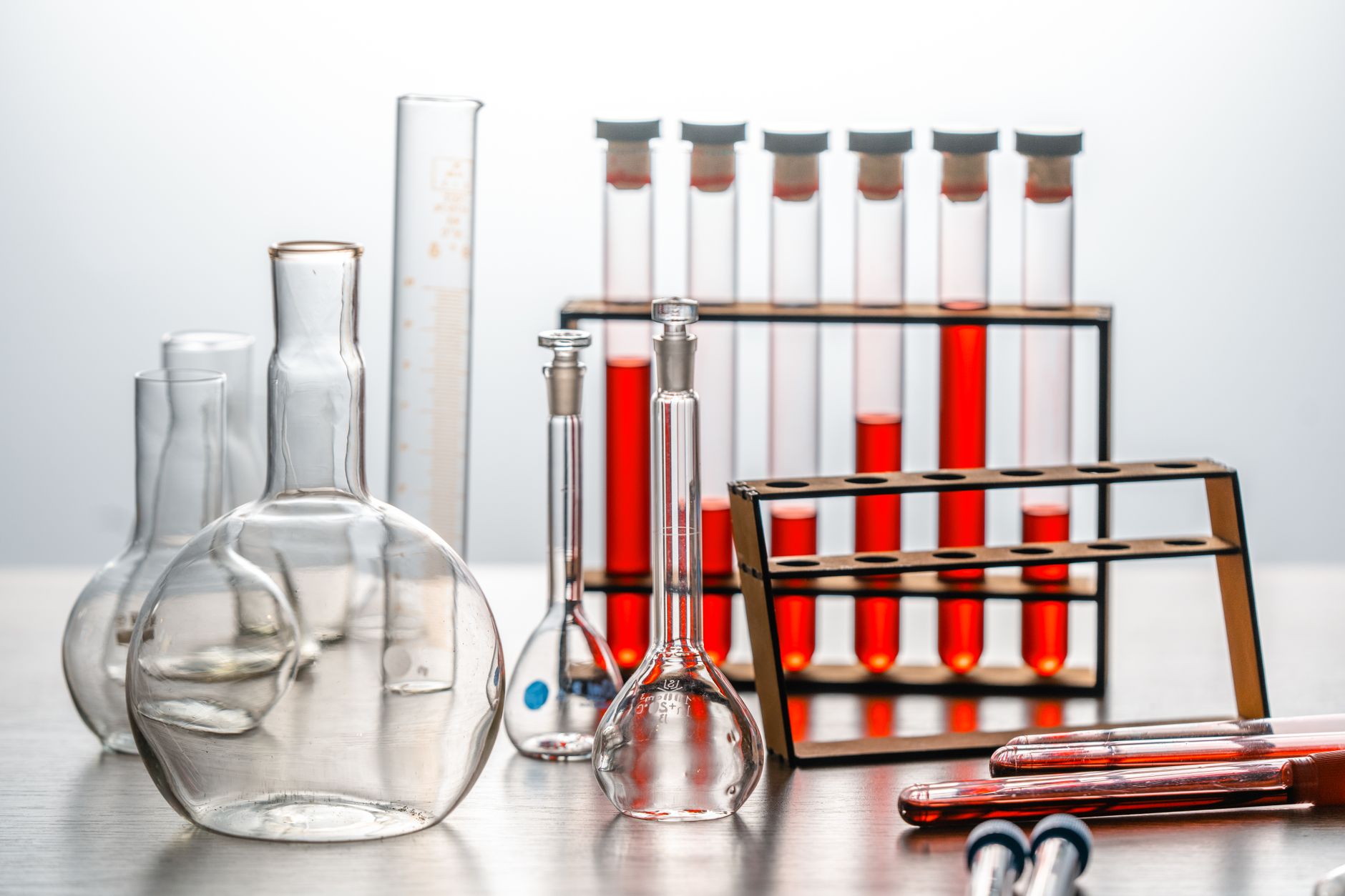 Close-up of various lab glassware with red liquids, ideal for scientific or educational use — UPI Study