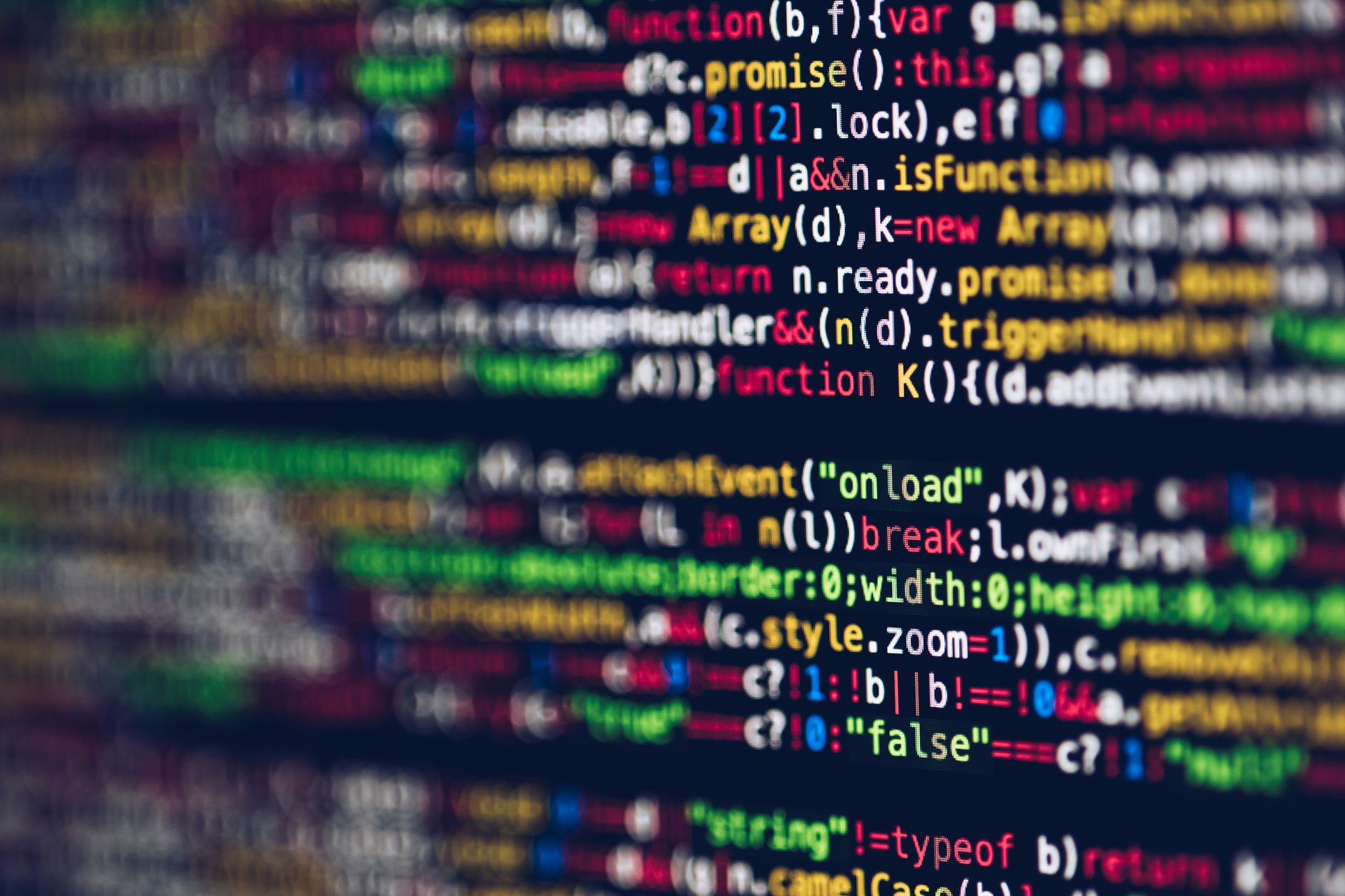 Vivid, blurred close-up of colorful code on a screen, representing web development and programming — UPI Study