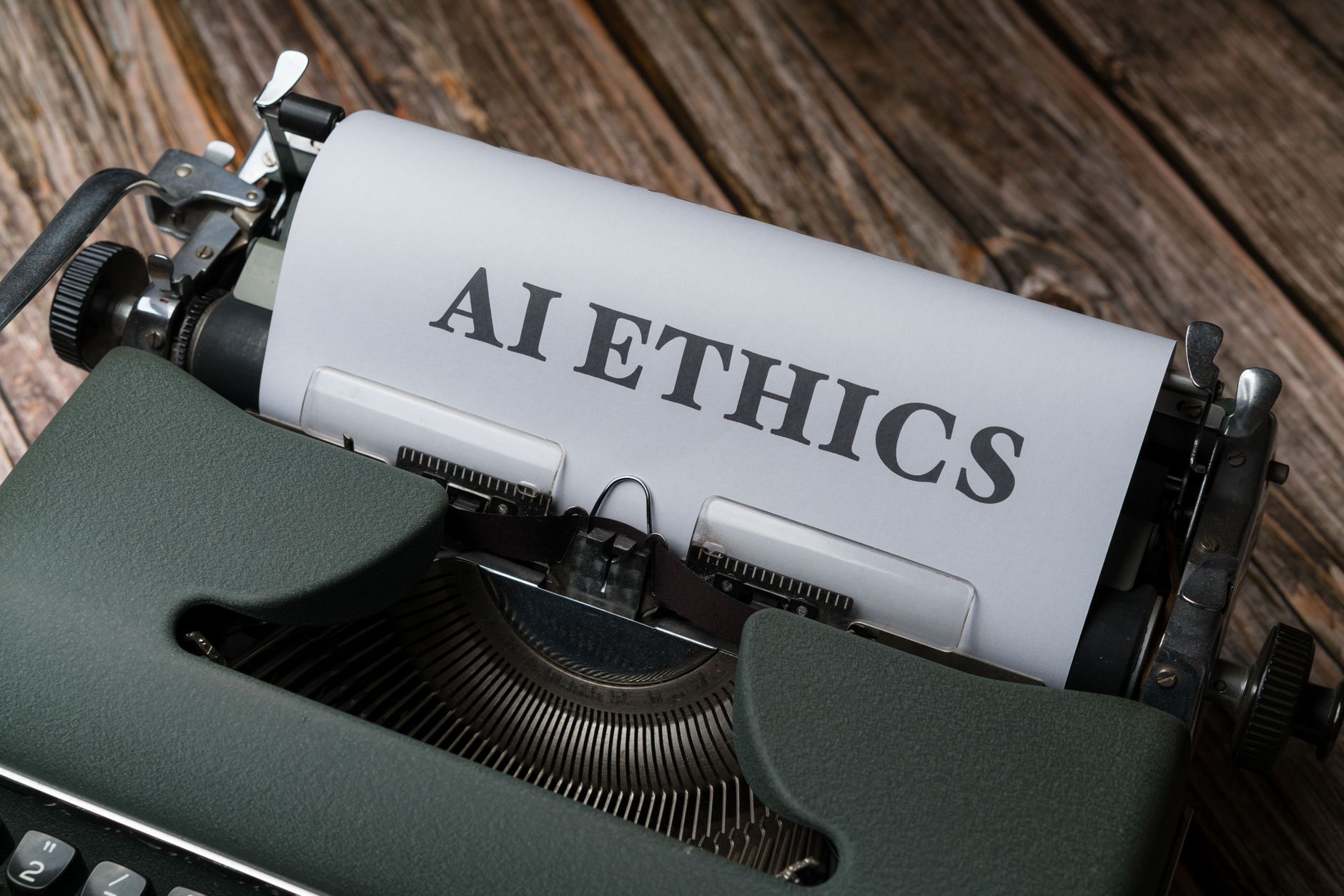 Retro typewriter with 'AI Ethics' on paper, conveying technology themes — UPI Study