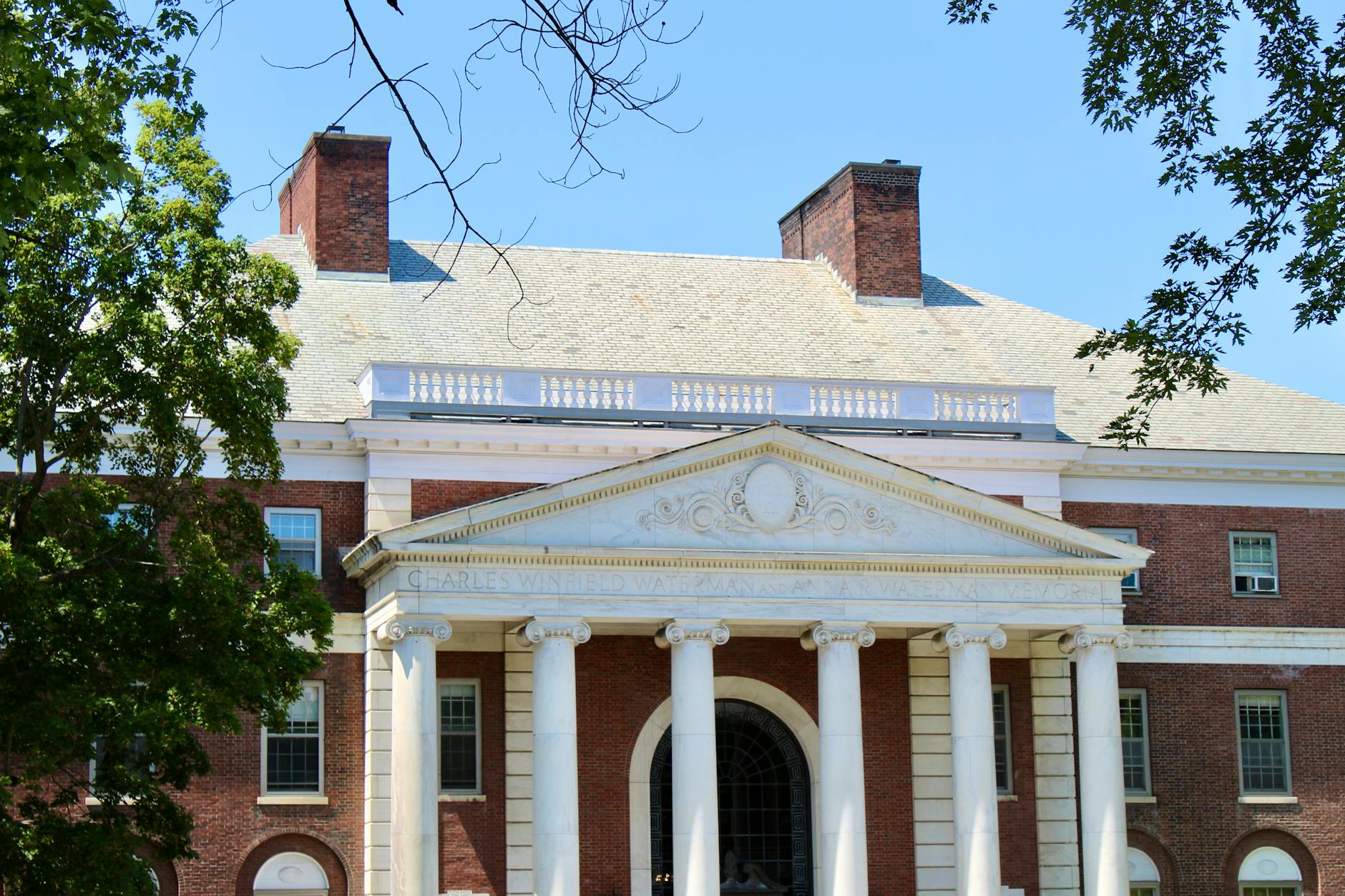 A classic brick university campus building with columns in Burlington, Vermont — UPI Study