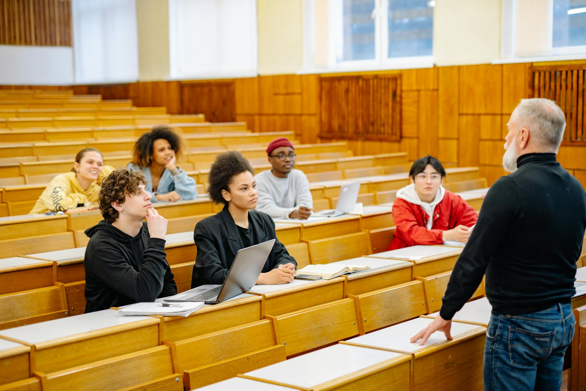 University students engaging in a diverse classroom setting with a lecturer — UPI Study