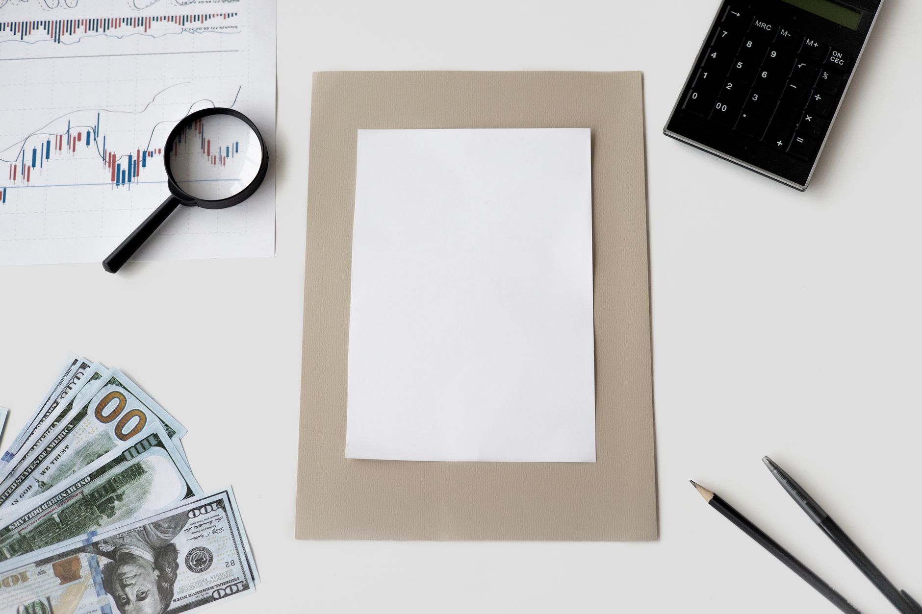 Flat lay of financial tools and blank paper for planning or mockup — UPI Study