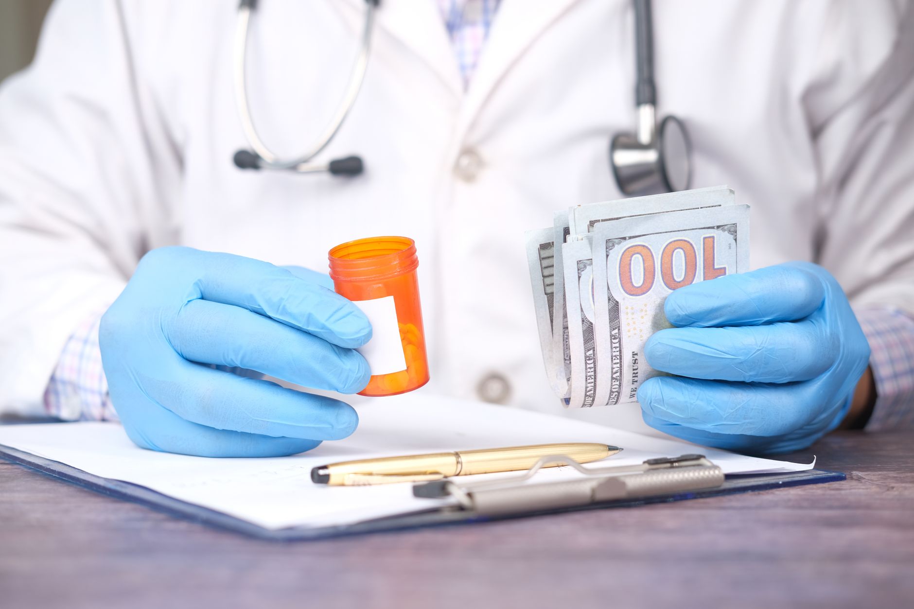 Doctor in gloves holding pill bottle and cash, highlighting medical expenses — UPI Study