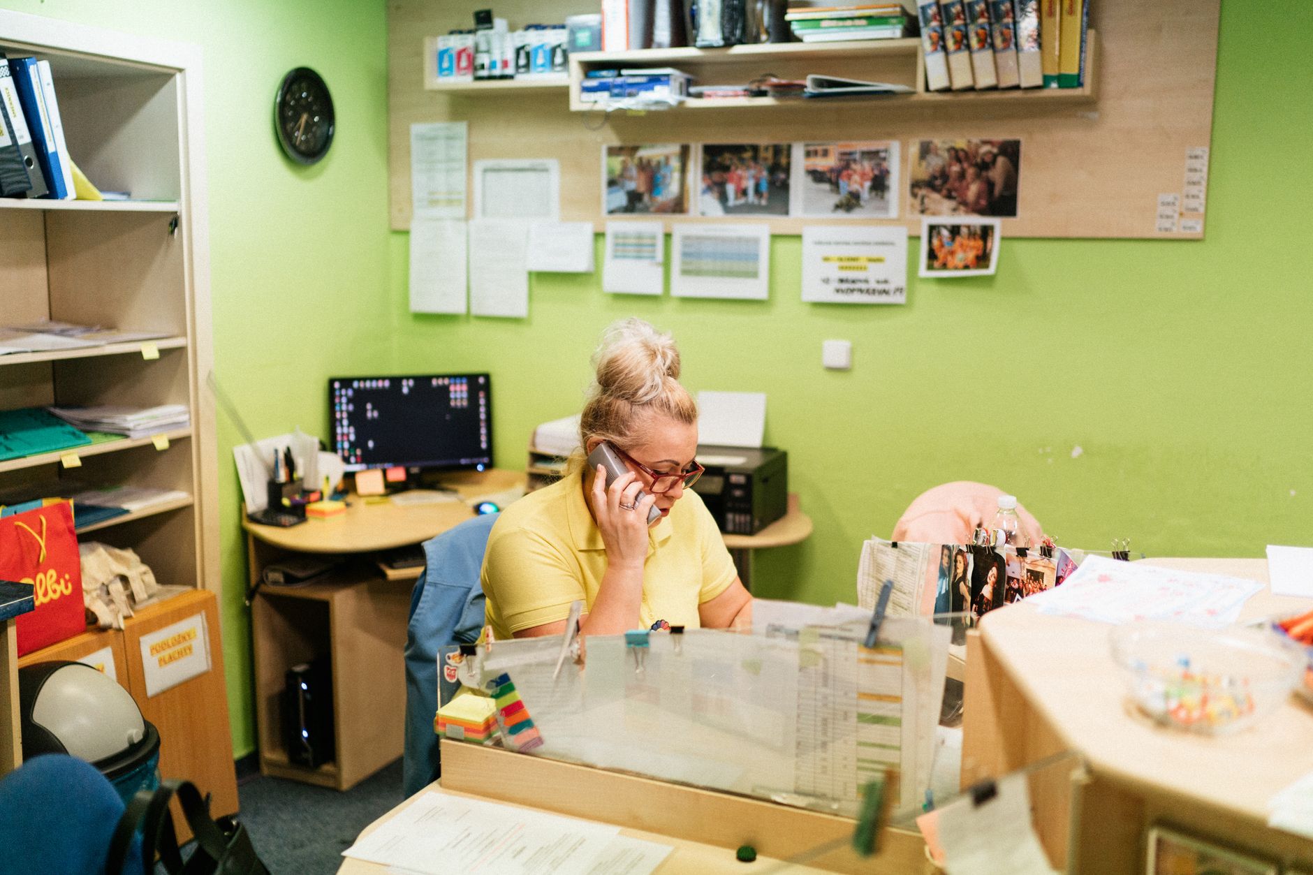 A caregiver talking on the phone at a nursing home reception desk in Karviná, Czech Republic — UPI Study