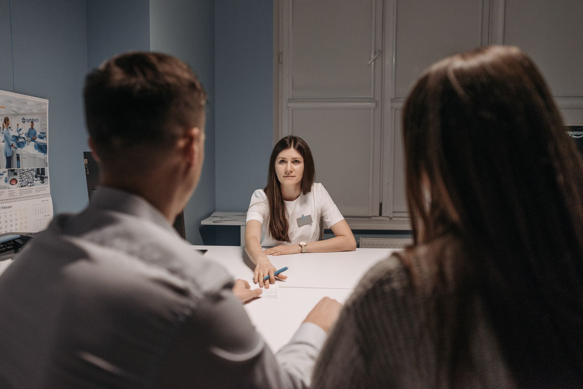 Professional meeting in a healthcare office setting with medical staff discussion — UPI Study