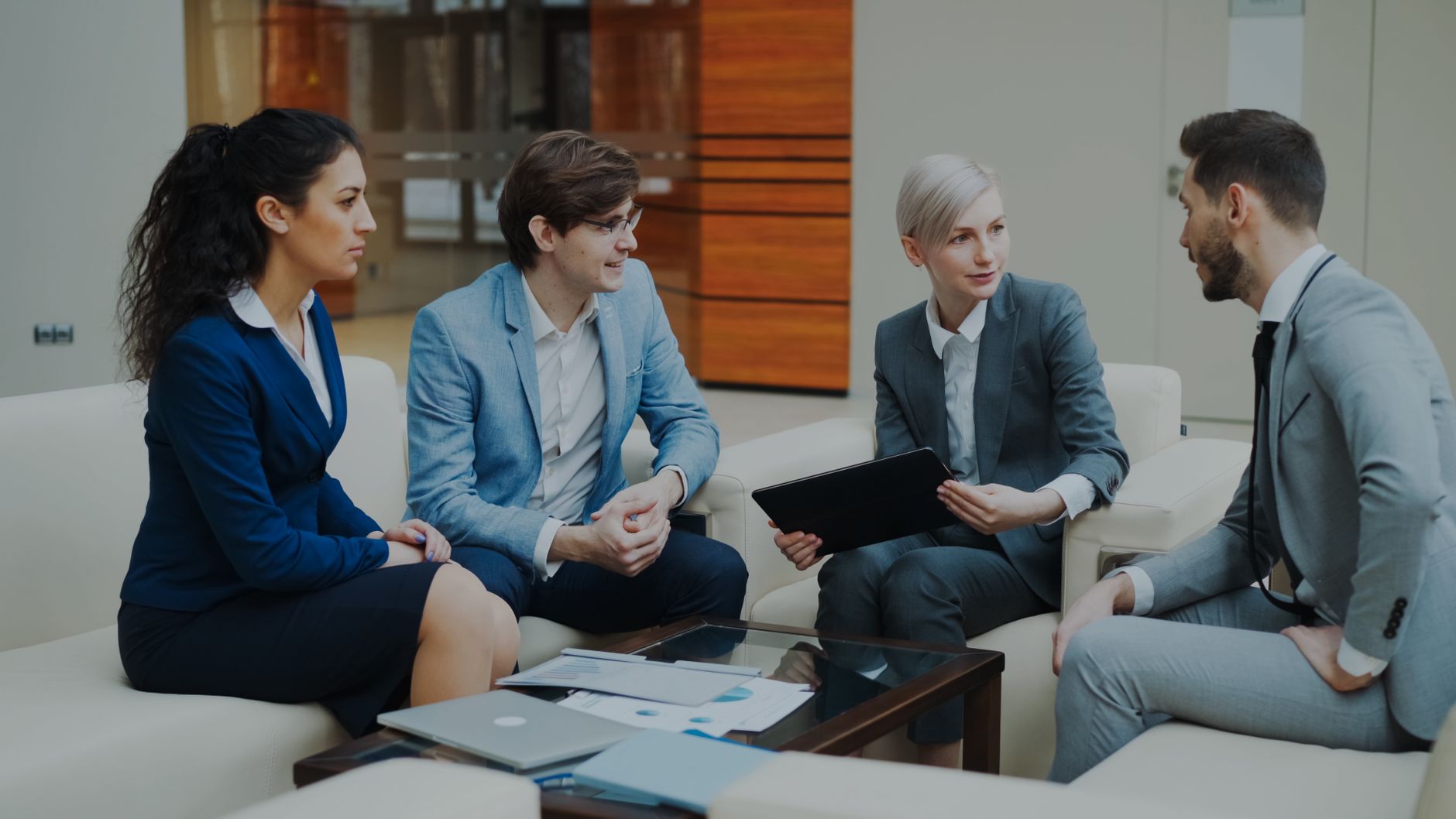 Group of professionals discussing strategy at an office — UPI Study