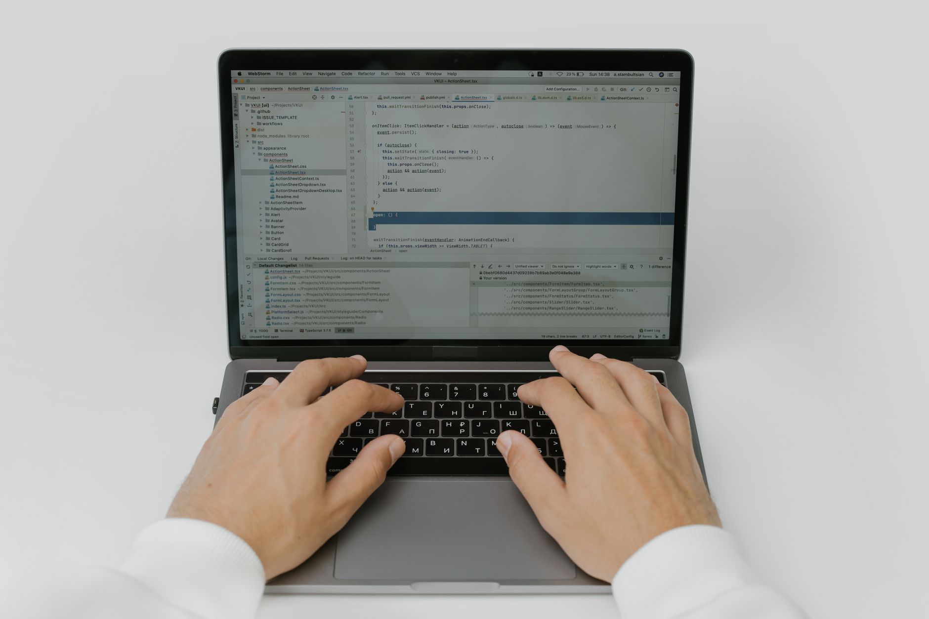 Close-up of hands coding on a laptop, showcasing software development in action — UPI Study