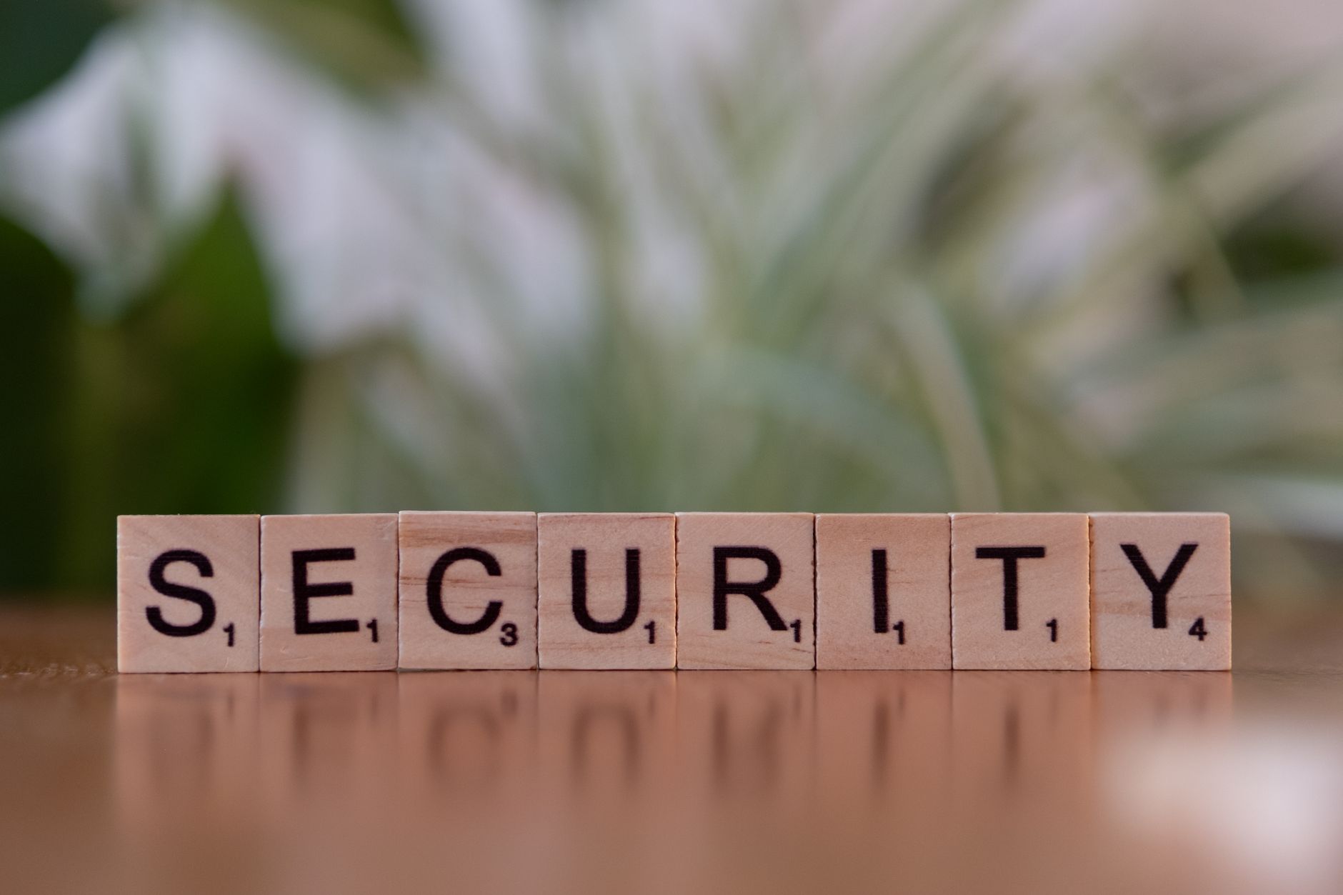 Close-up of wooden Scrabble tiles spelling SECURITY, symbolizing cybersecurity and protection — UPI Study