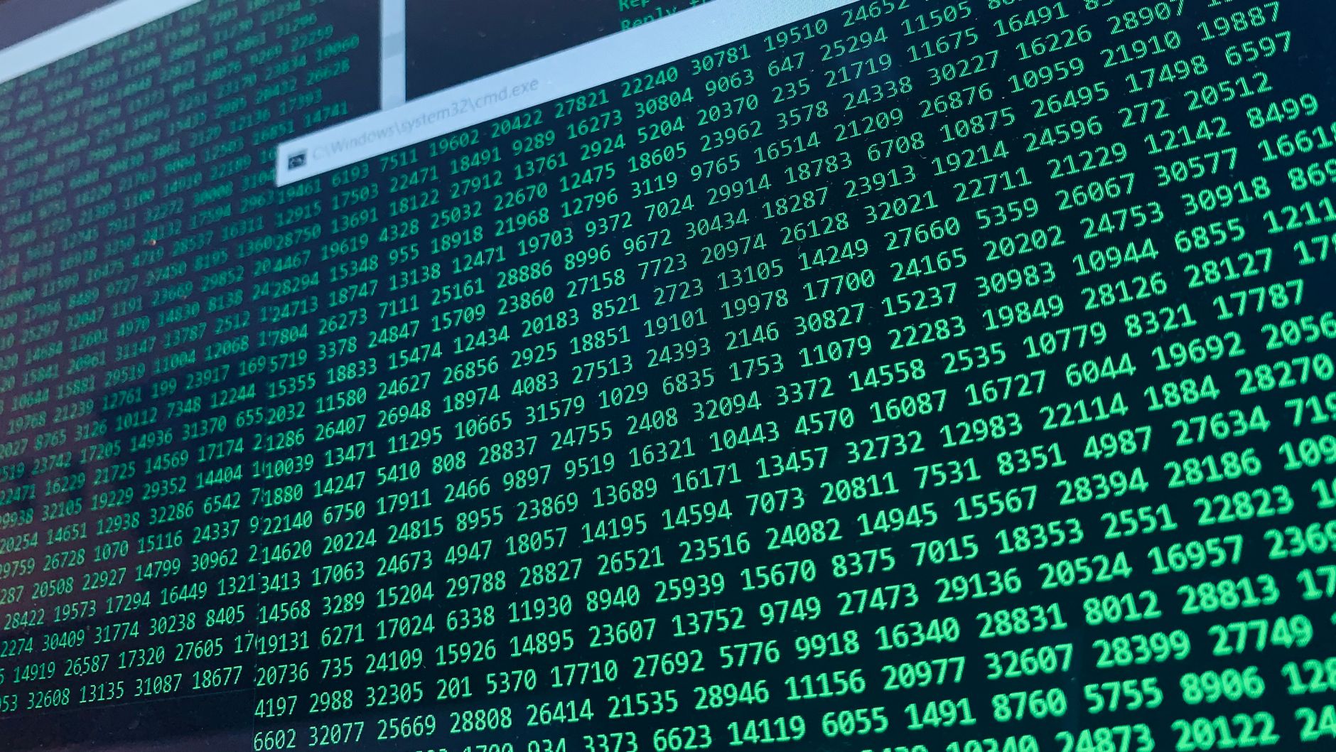 Vibrant green numbers on a computer screen, showcasing binary code and data streams — UPI Study