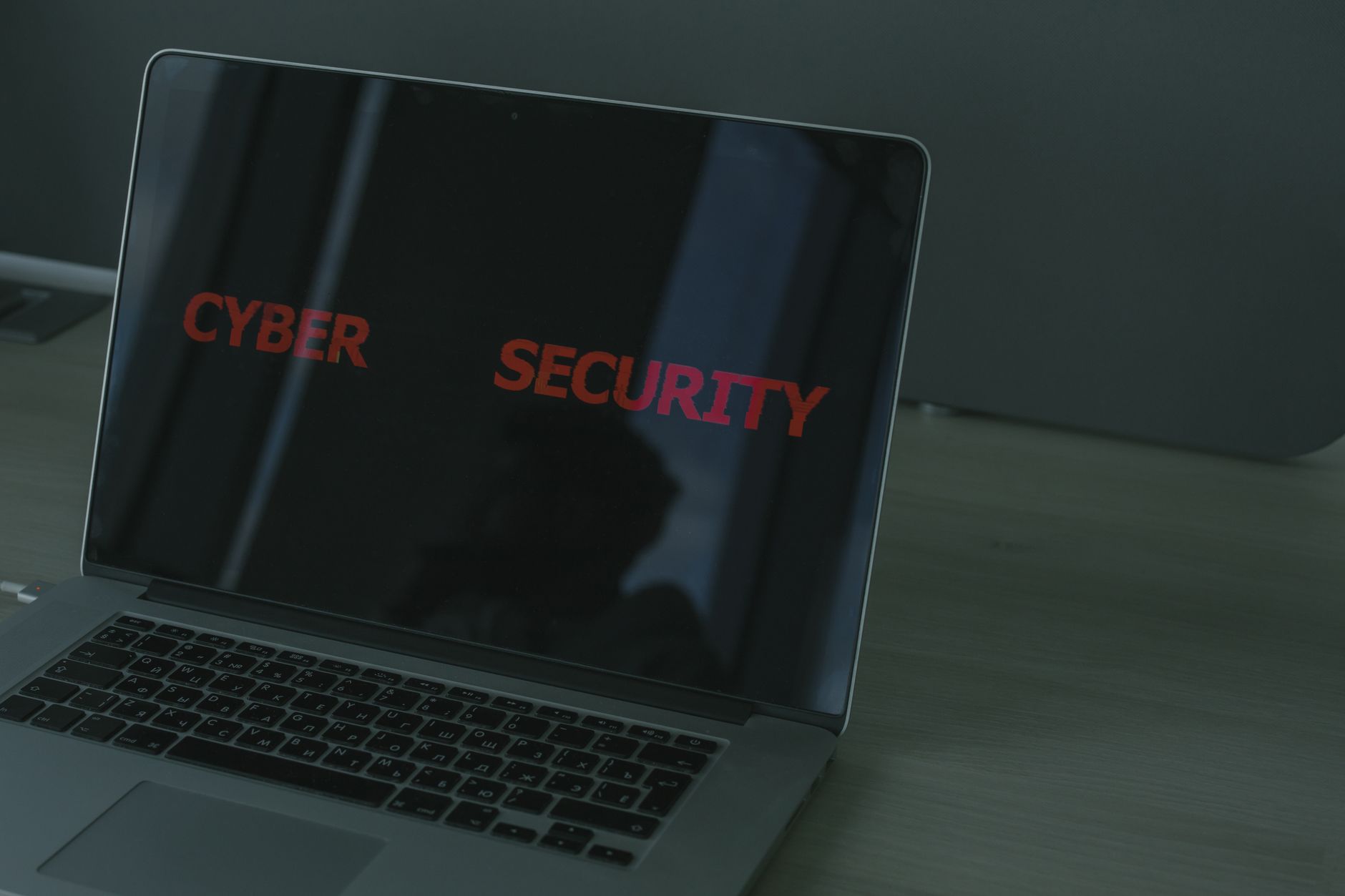 Close-up of a laptop displaying cybersecurity text, emphasizing digital security themes — UPI Study