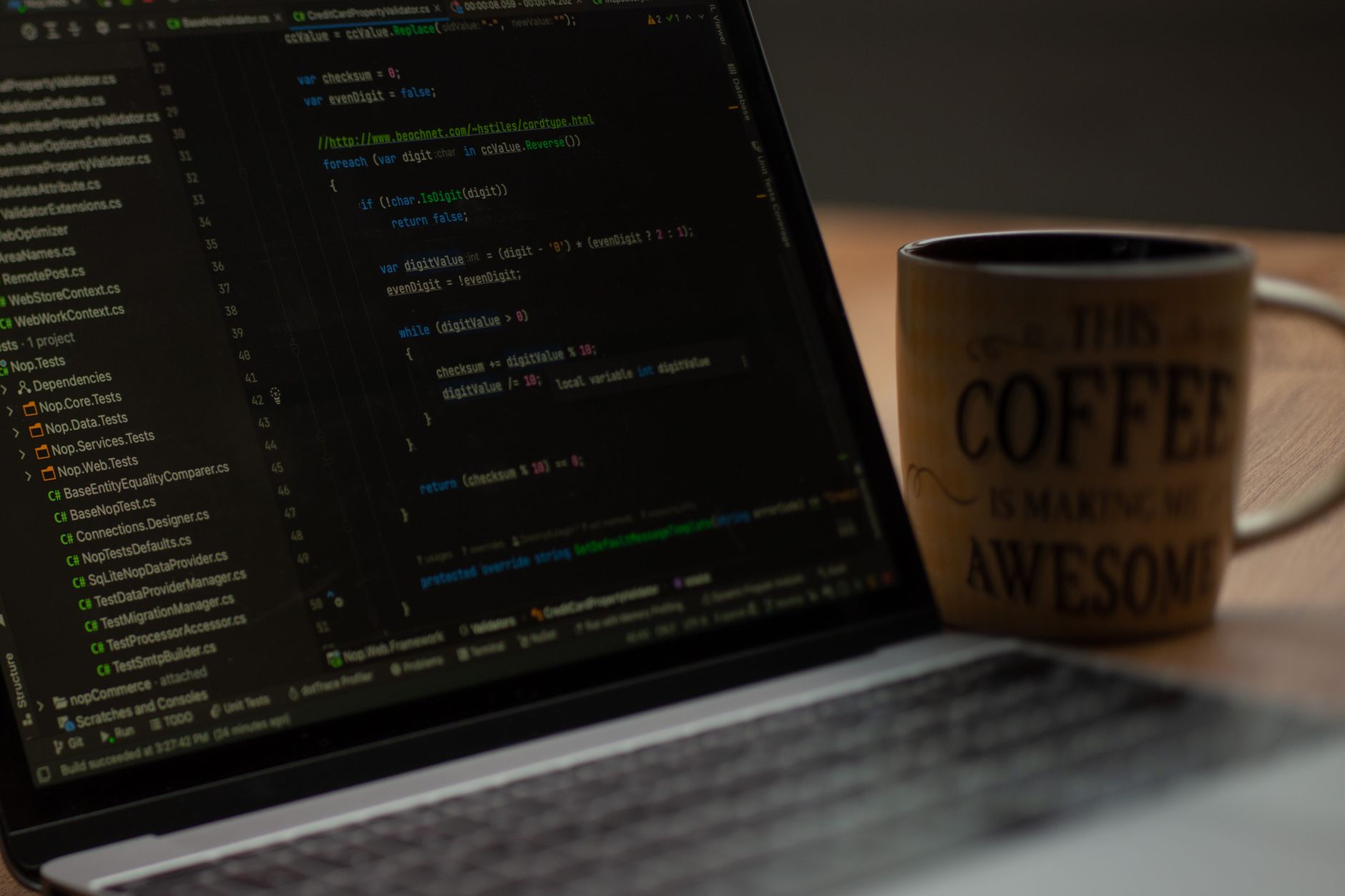 Close-up of a laptop screen with code and a coffee mug, perfect for tech abstract themes — UPI Study
