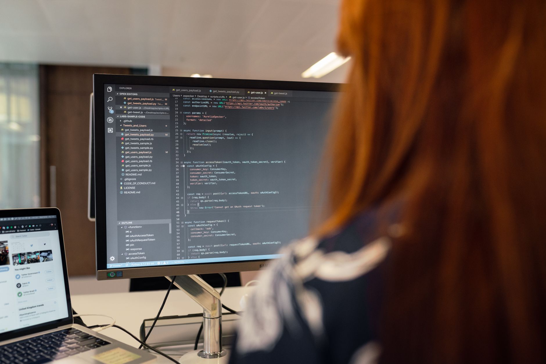 A female engineer works on code in a contemporary office setting, showcasing software development — UPI Study