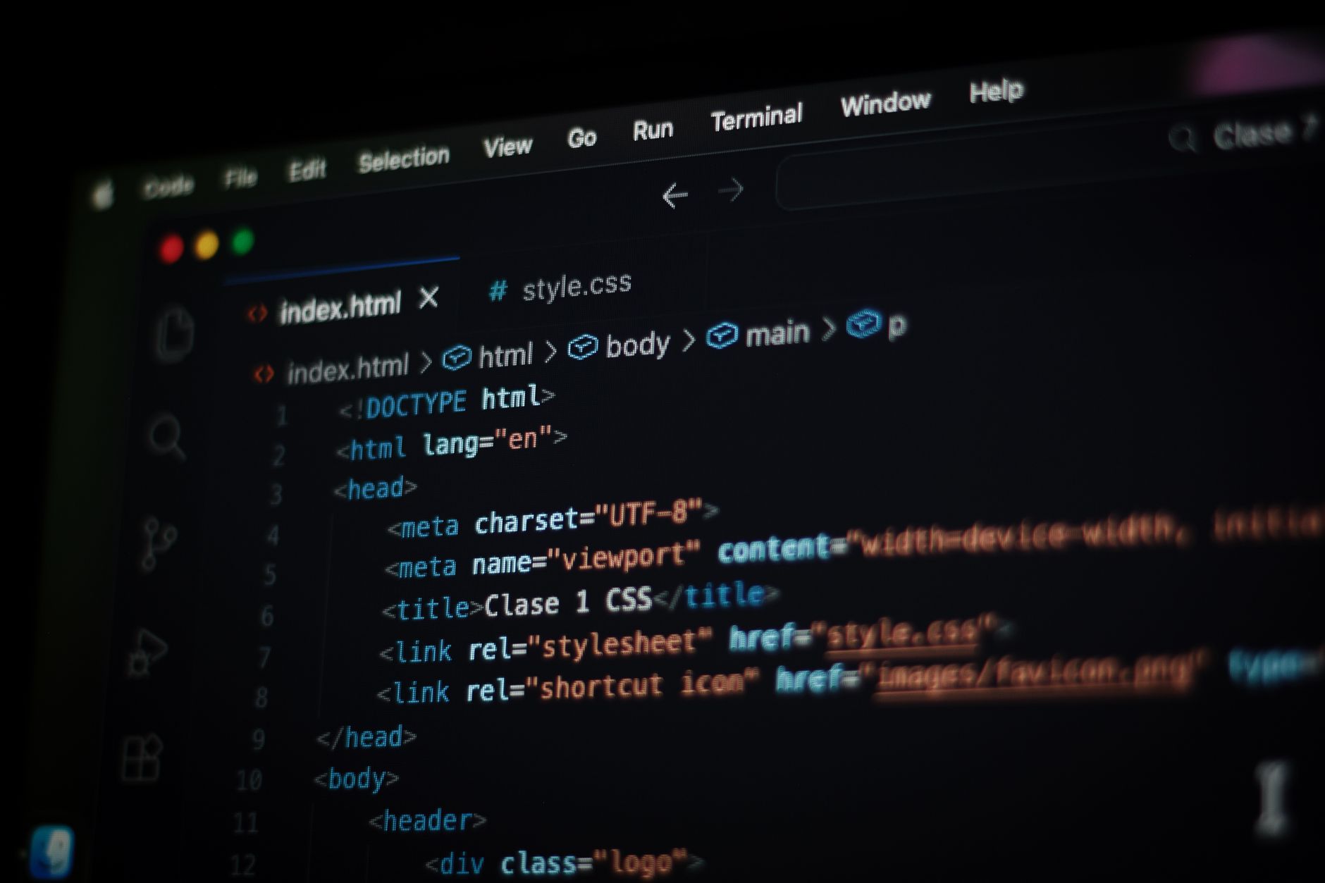 Close-up of HTML code displayed on a computer screen in dark mode, focusing on programming concepts — UPI Study