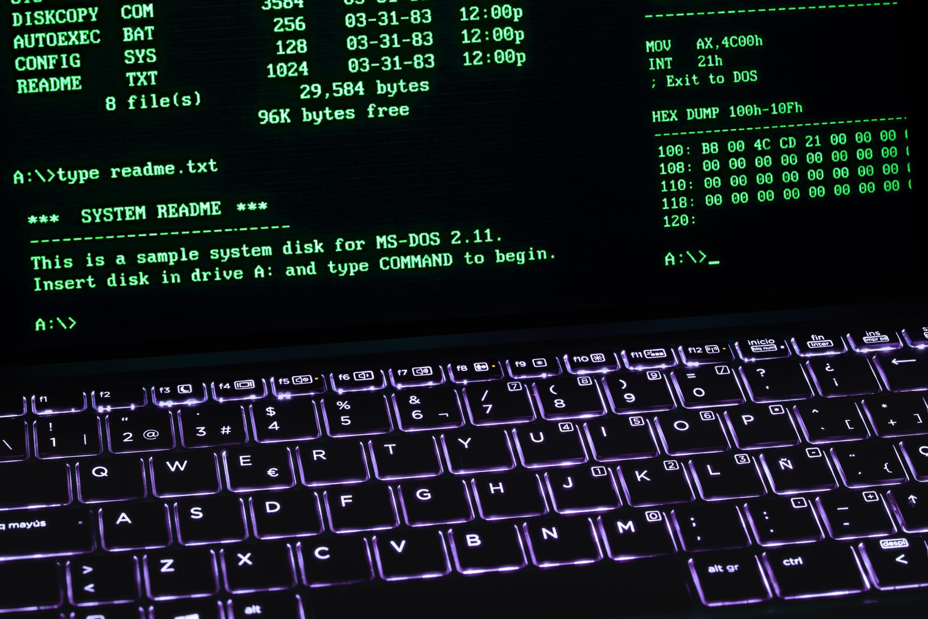A classic MS-DOS terminal screen displayed on a laptop keyboard with vivid illumination — UPI Study
