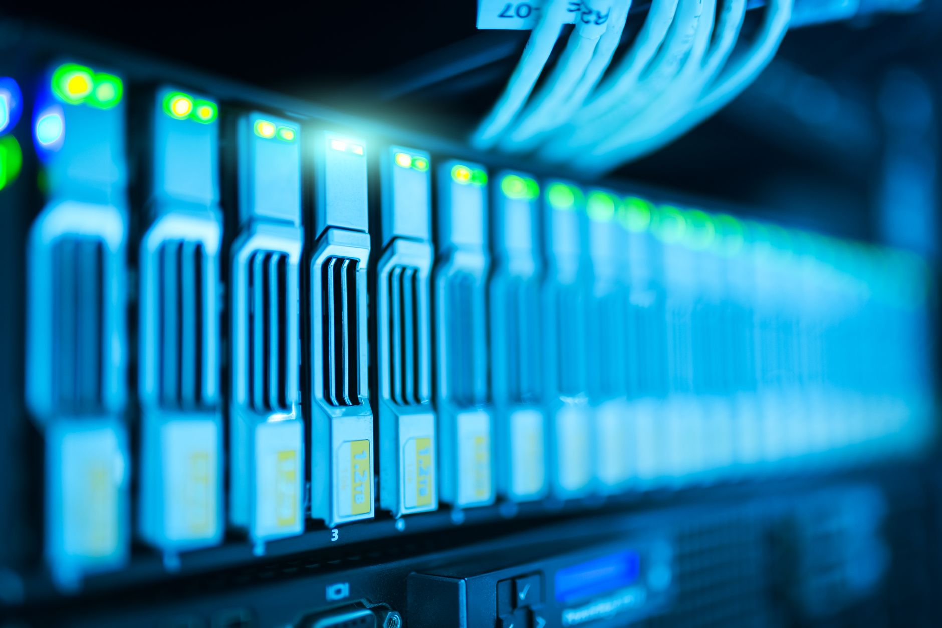 Detailed image of a server rack with glowing lights in a modern data center — UPI Study