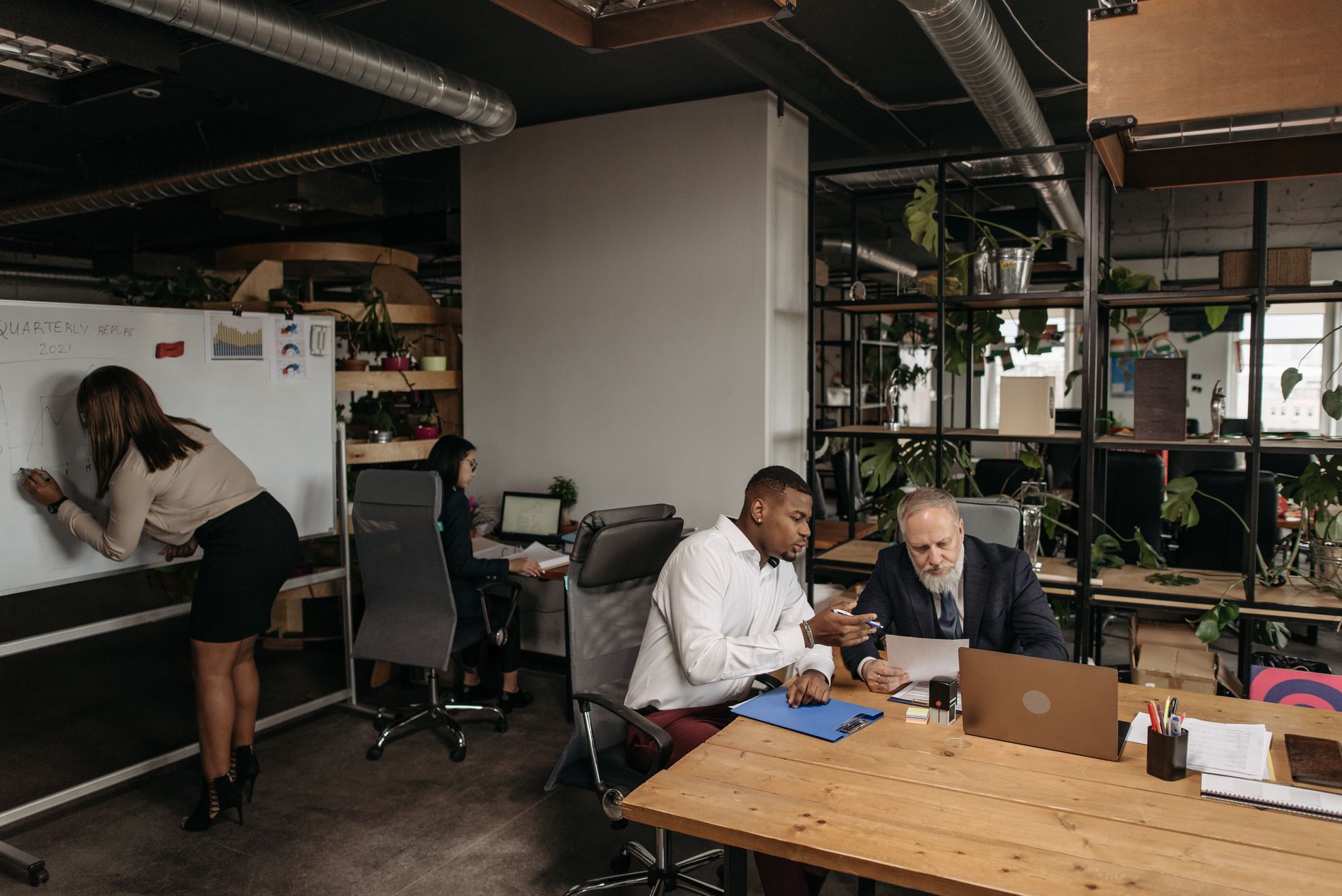 Diverse team collaborating in a modern office environment, planning strategy — UPI Study