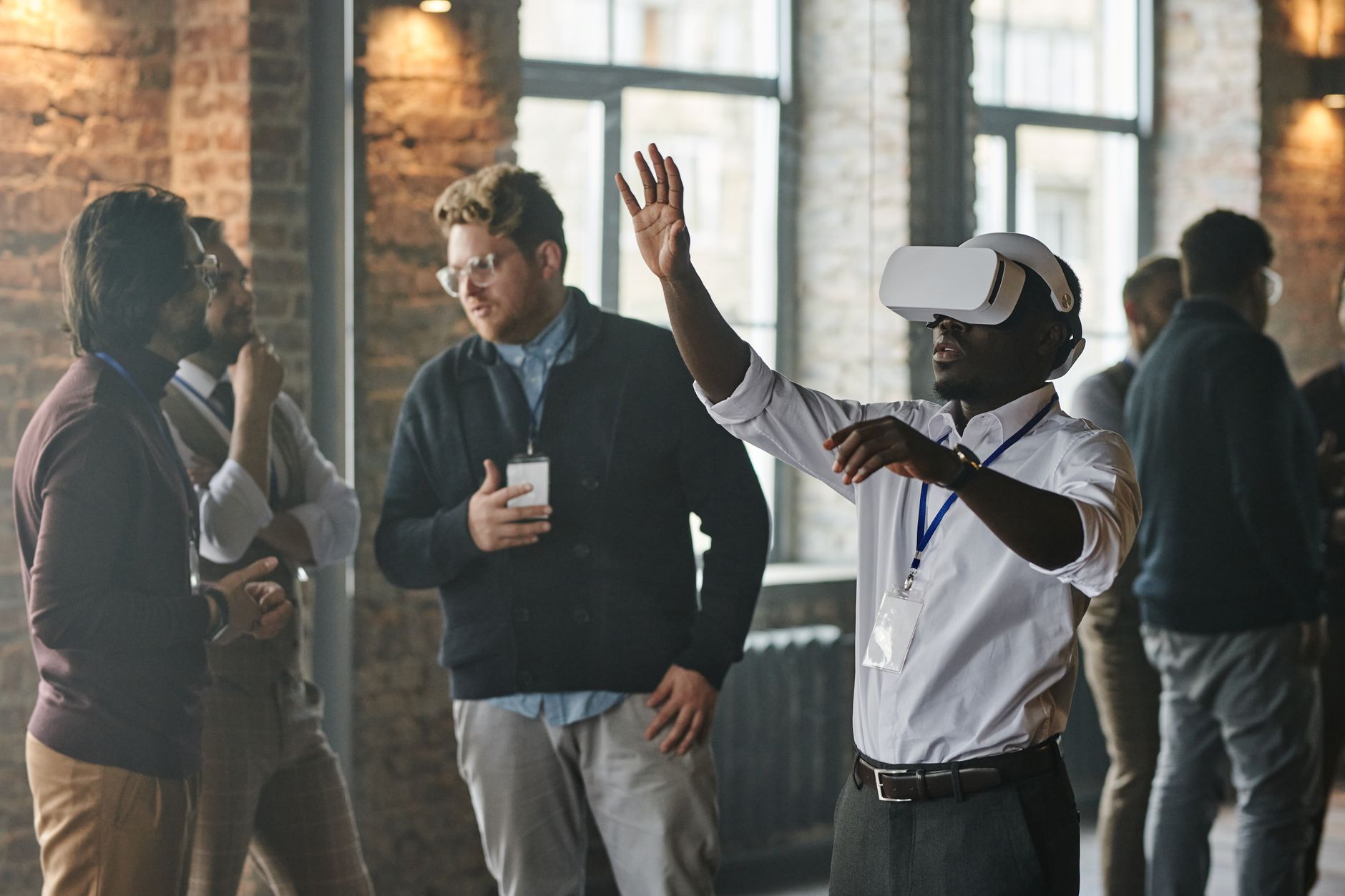 A diverse group of professionals engaging in a business setting, featuring virtual reality technology — UPI Study