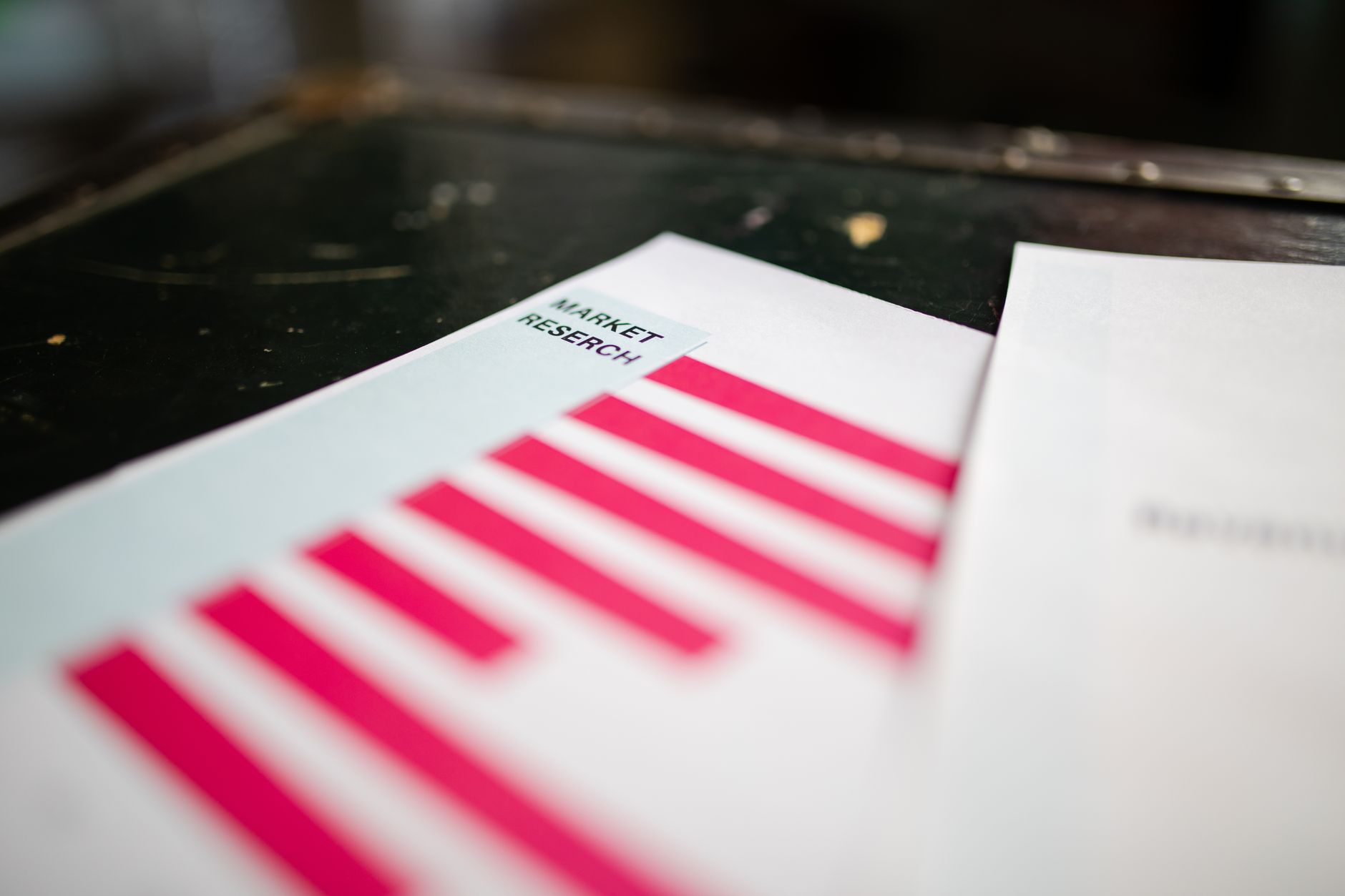 A detailed close-up of a market research document featuring a bar graph and a focus on market trends — UPI Study
