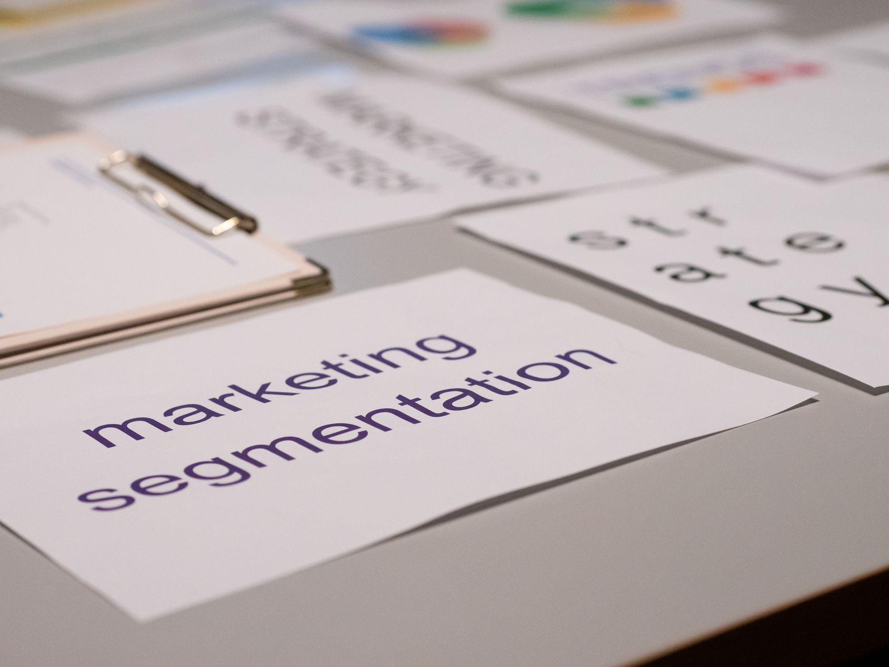 Close-up of various marketing documents on a desk, perfect for business and strategy discussions — UPI Study