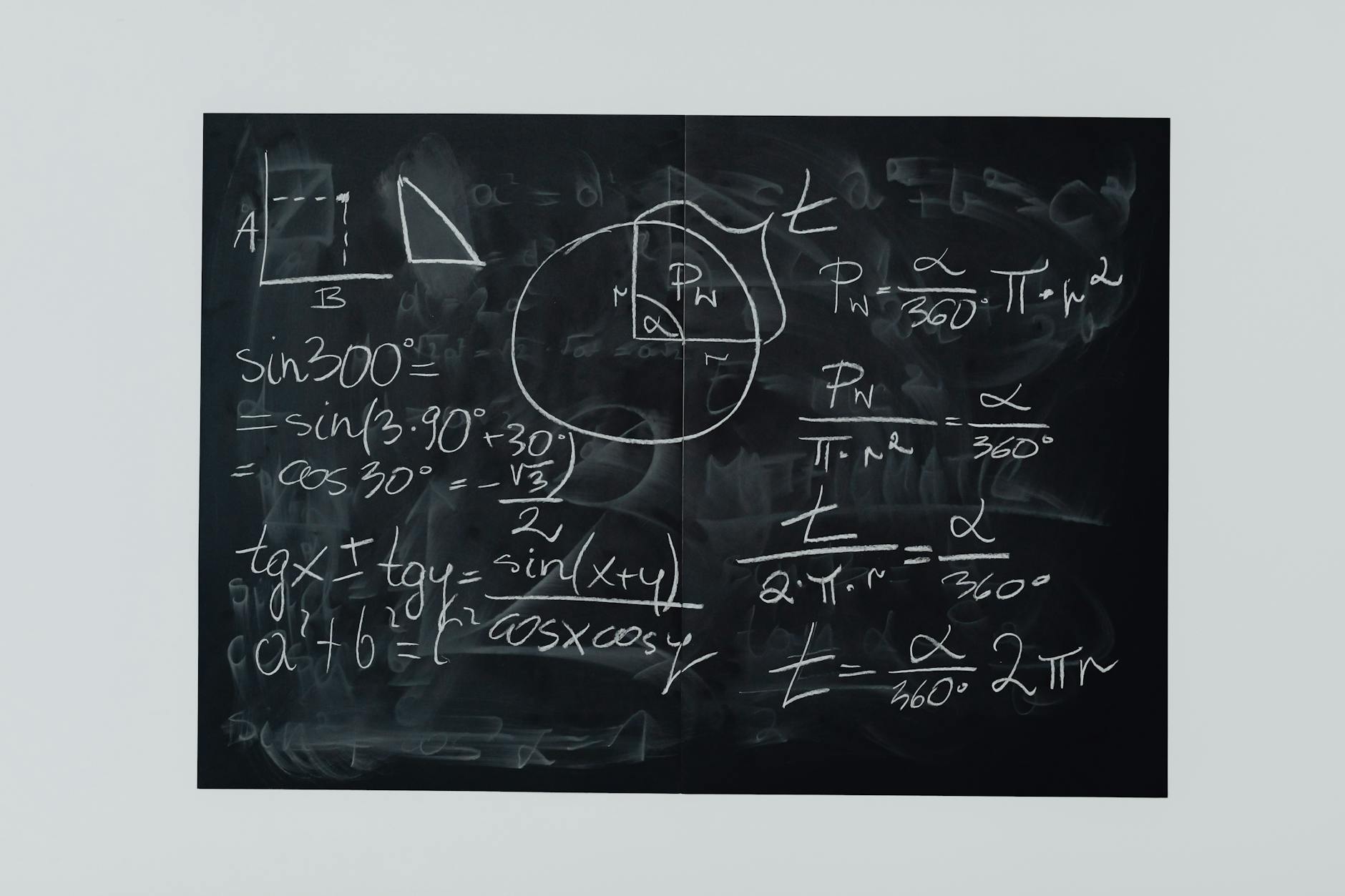 Detailed view of mathematical equations and diagrams on a blackboard — UPI Study
