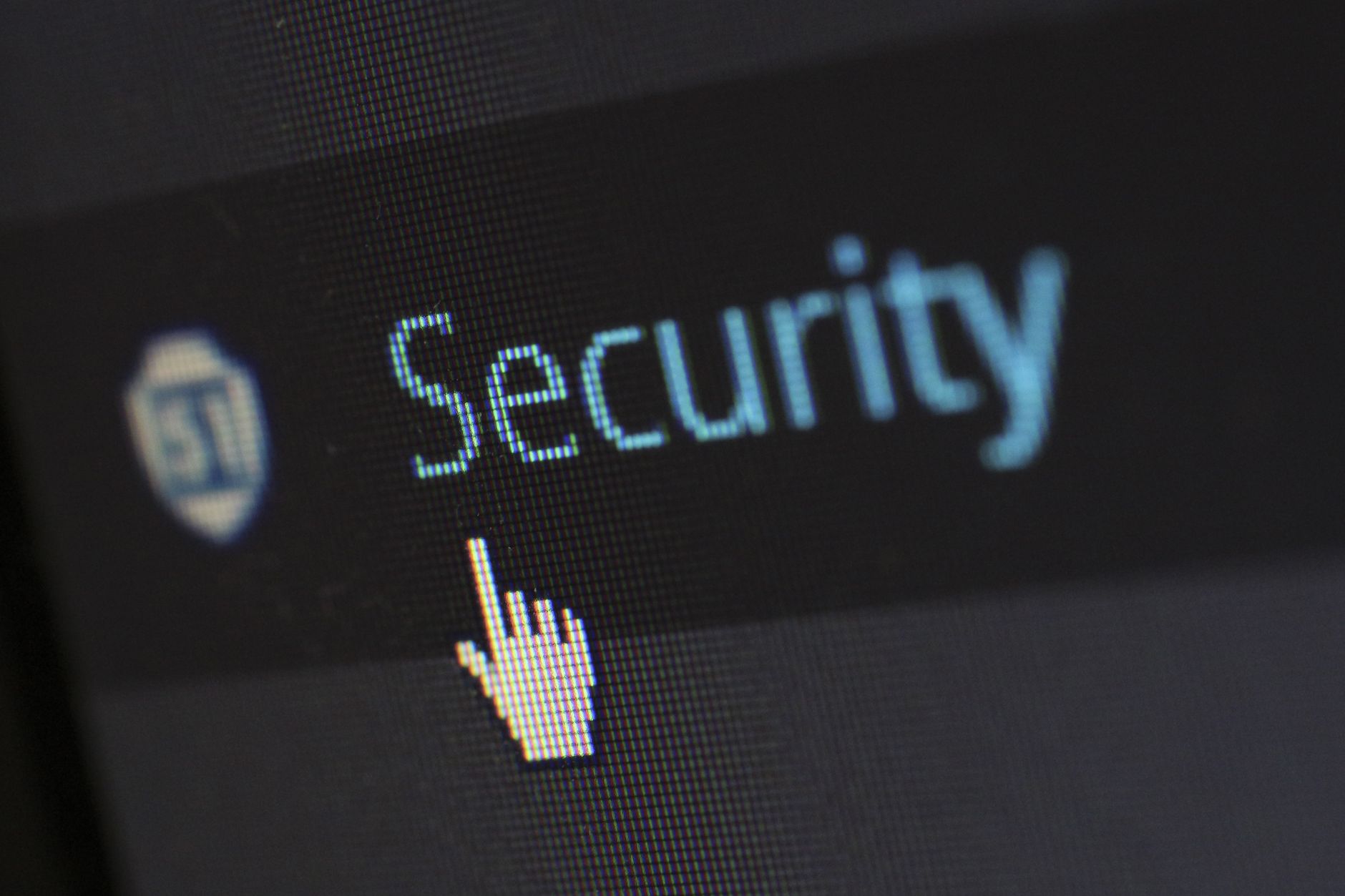 Close-up view of a mouse cursor over digital security text on display — UPI Study