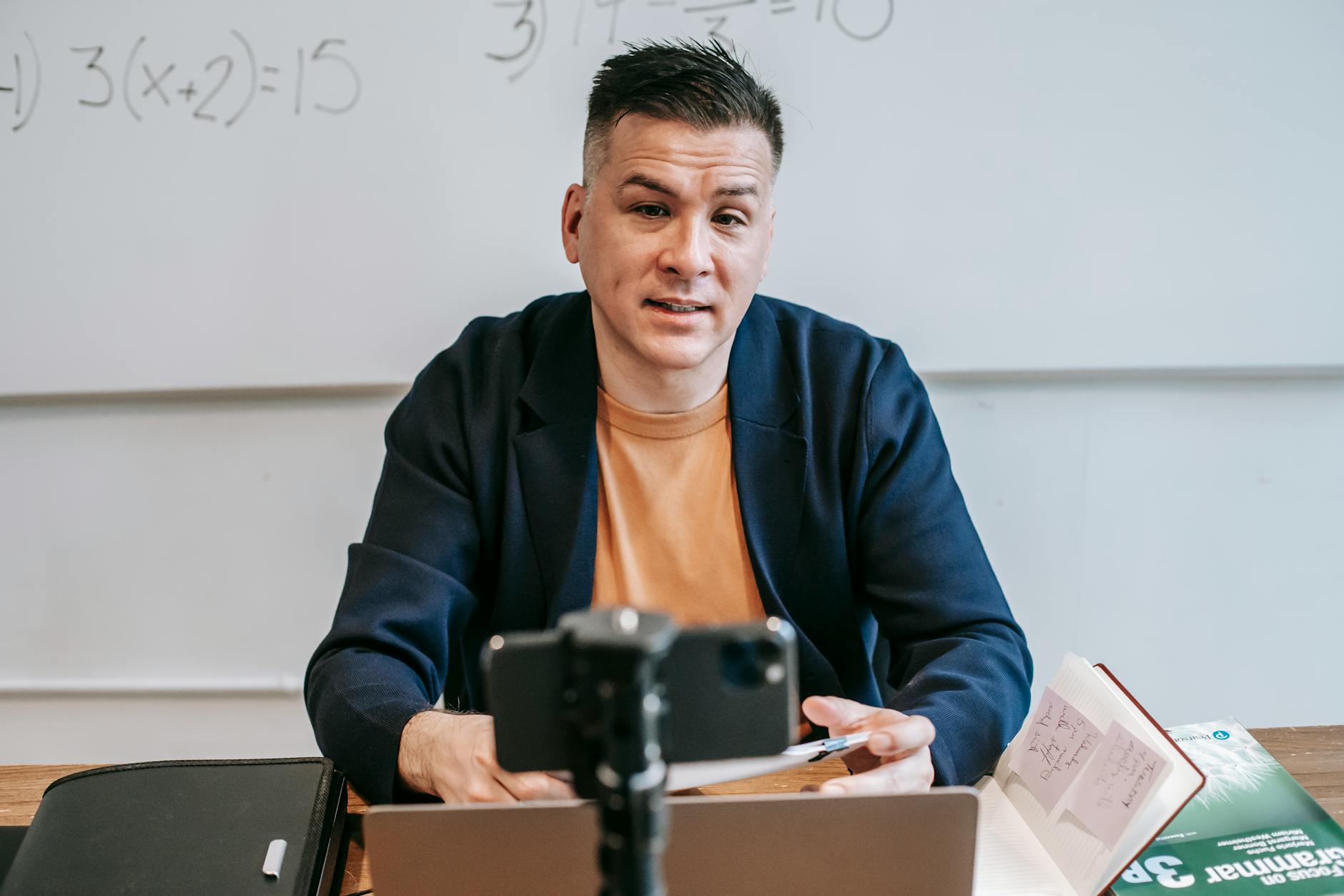 A professional educator conducting an online class, engaging with students via video call — UPI Study