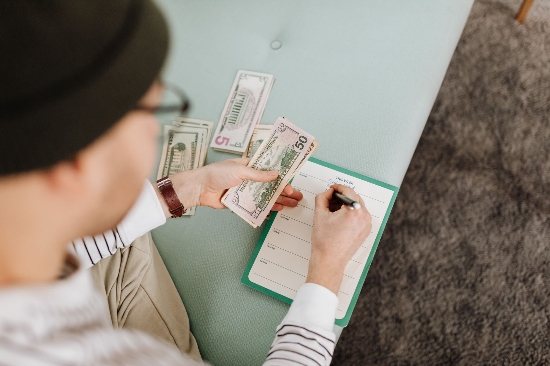 Individual budgeting with US dollars and a planner, focusing on financial planning — UPI Study