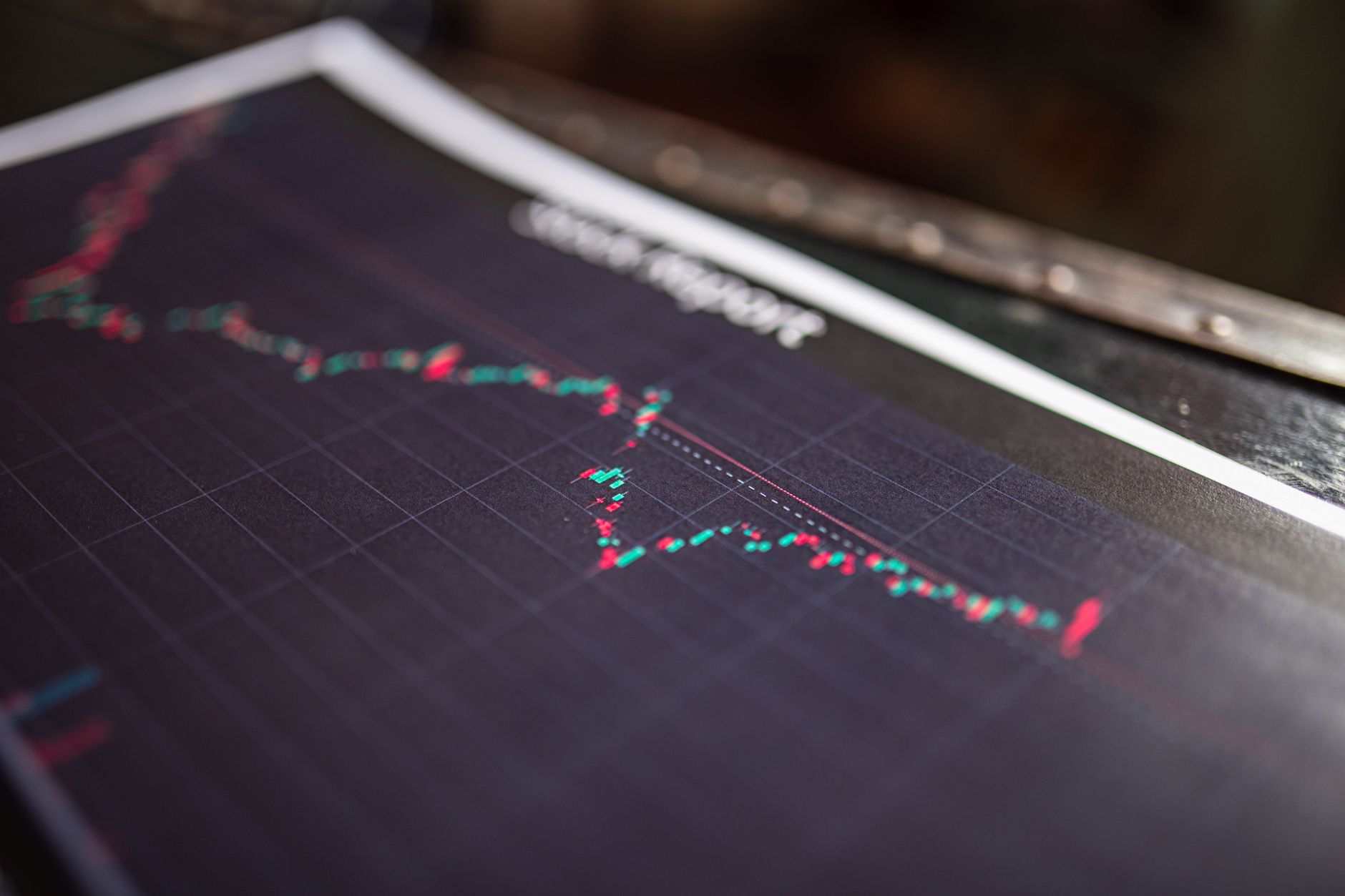 Close-up of a stock report showing a financial data graph — UPI Study