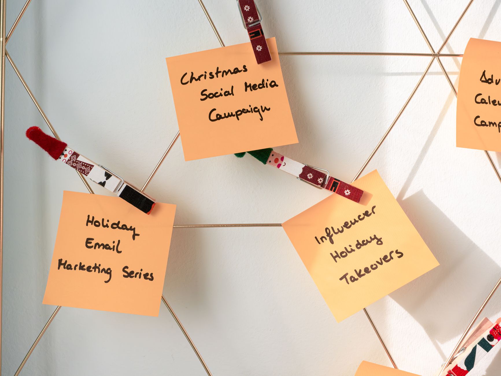 Sticky notes with holiday marketing ideas for Christmas social media and email campaigns — UPI Study