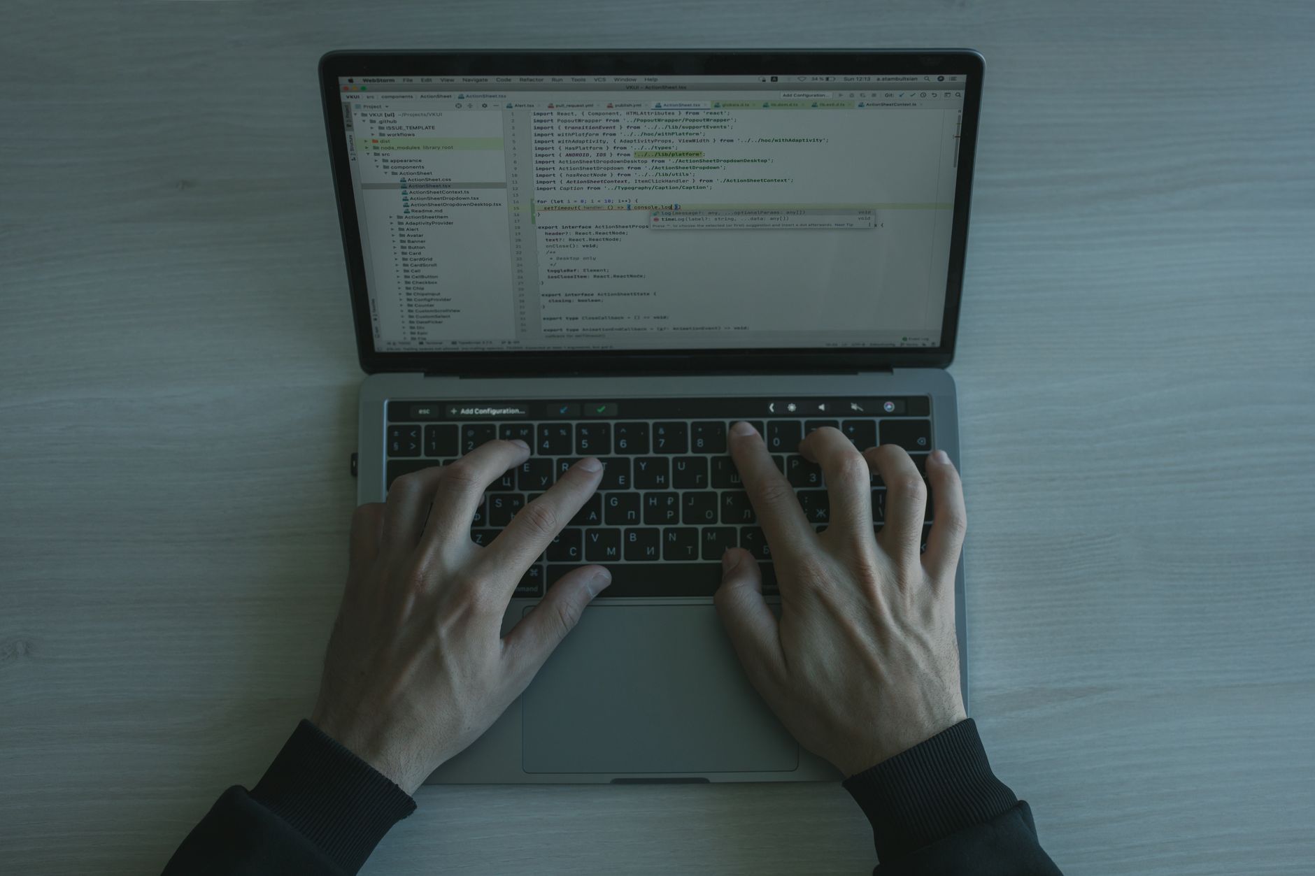 Close-up view of a programmer coding on a laptop, showcasing modern software development — UPI Study