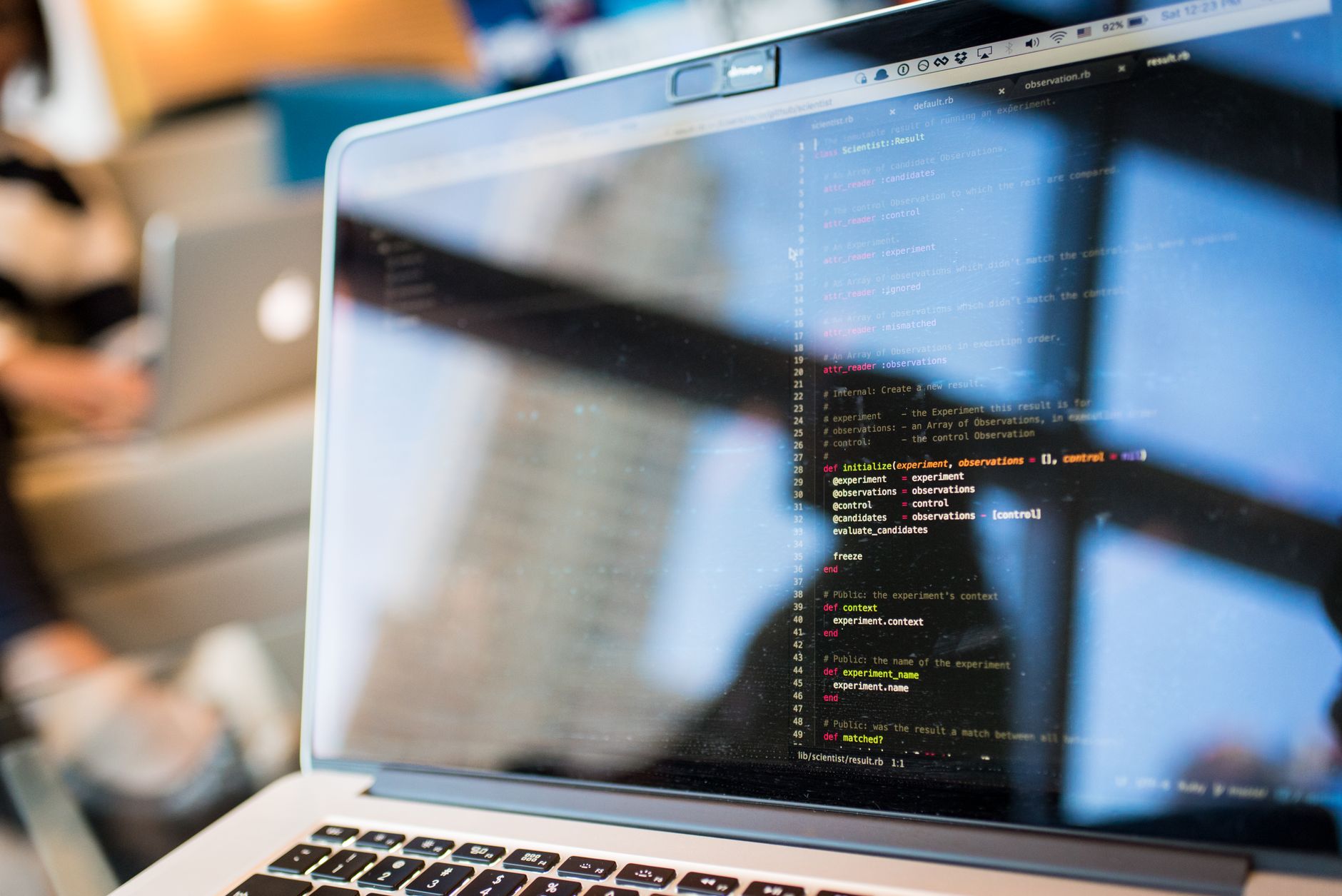 Laptop displaying code with reflection, perfect for tech and programming themes — UPI Study