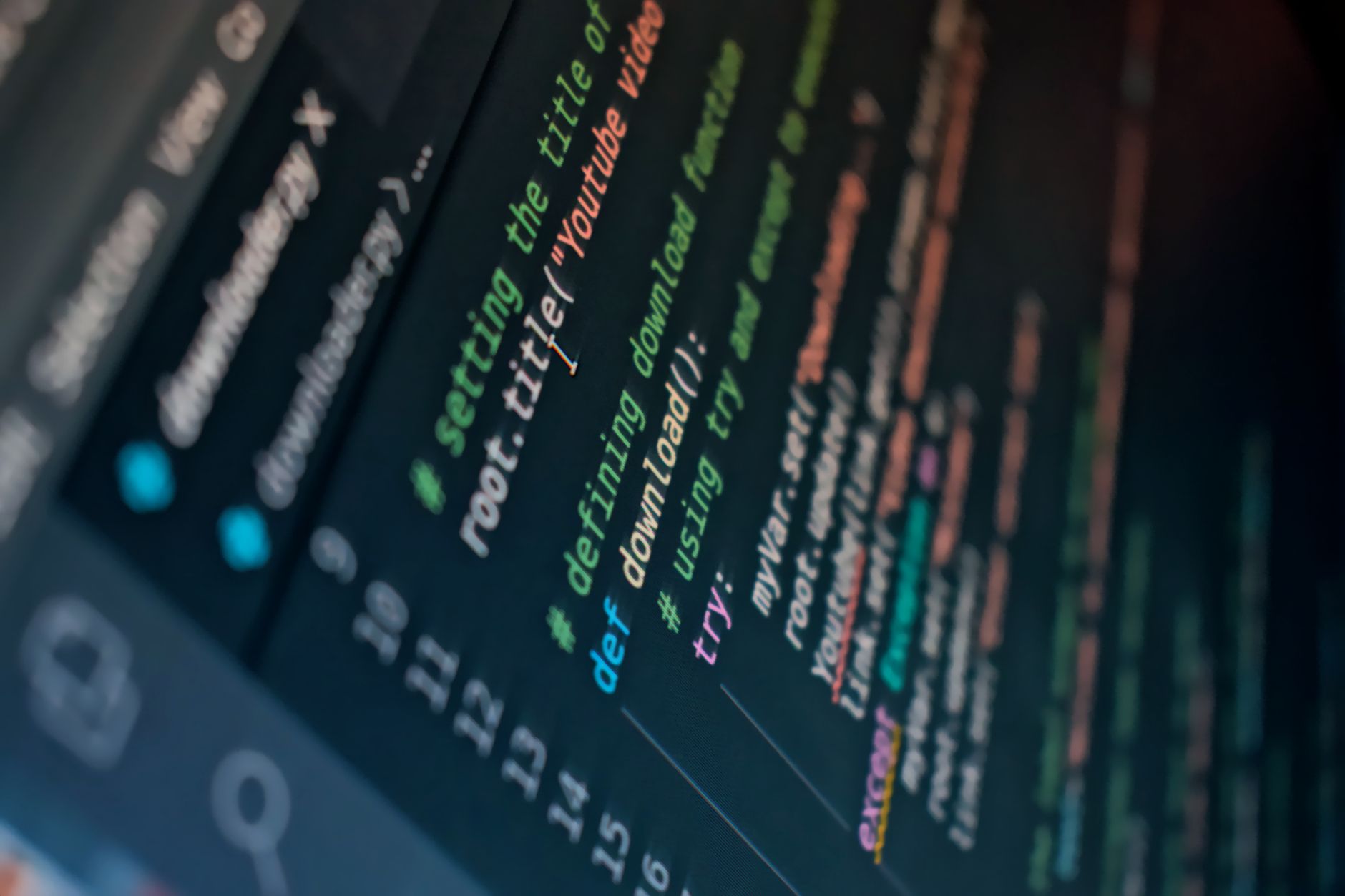 Detailed view of computer code highlighting syntax in colors on a screen — UPI Study