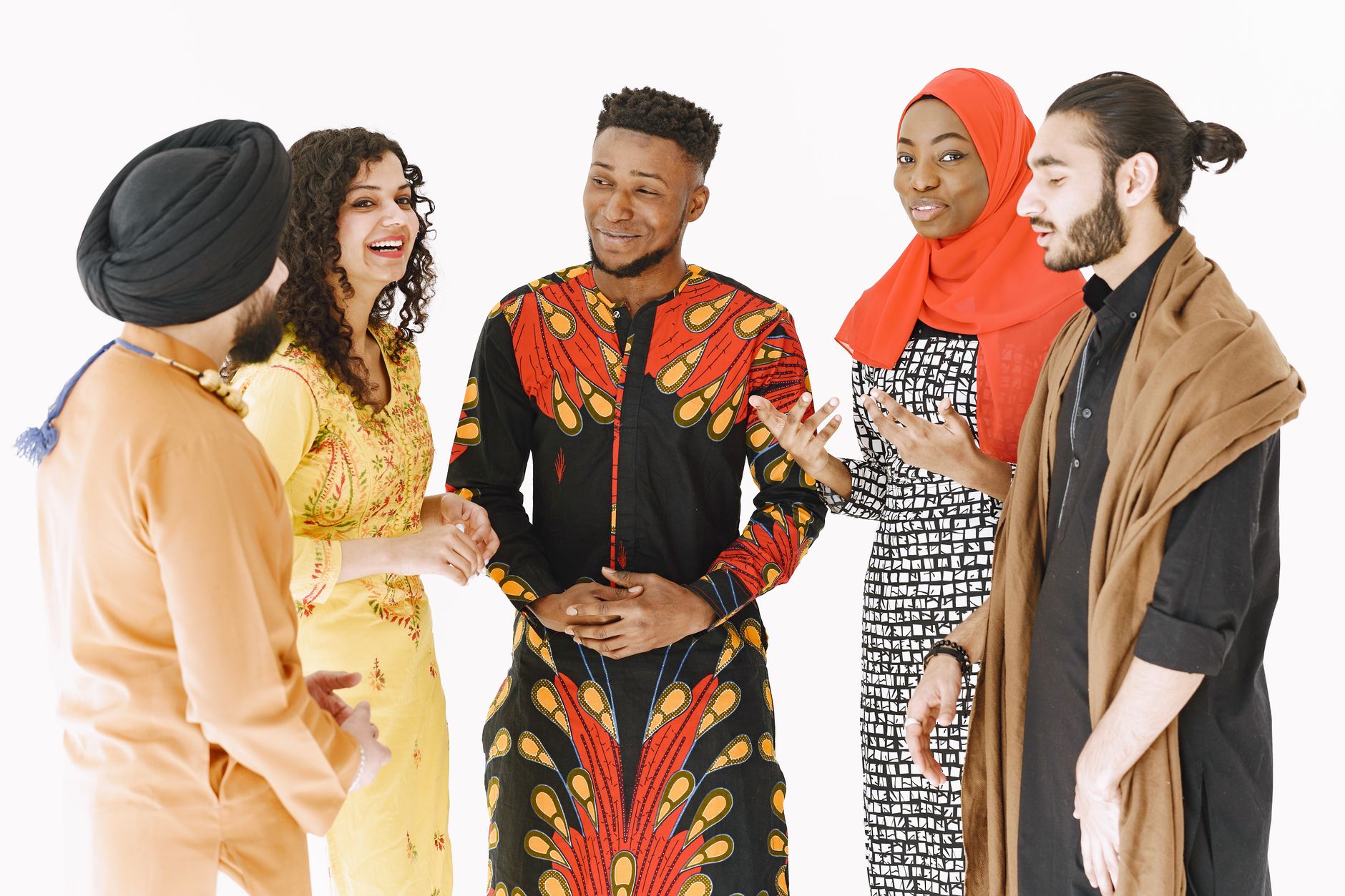 Multicultural group of adults in traditional attire gathered and conversing energetically — UPI Study