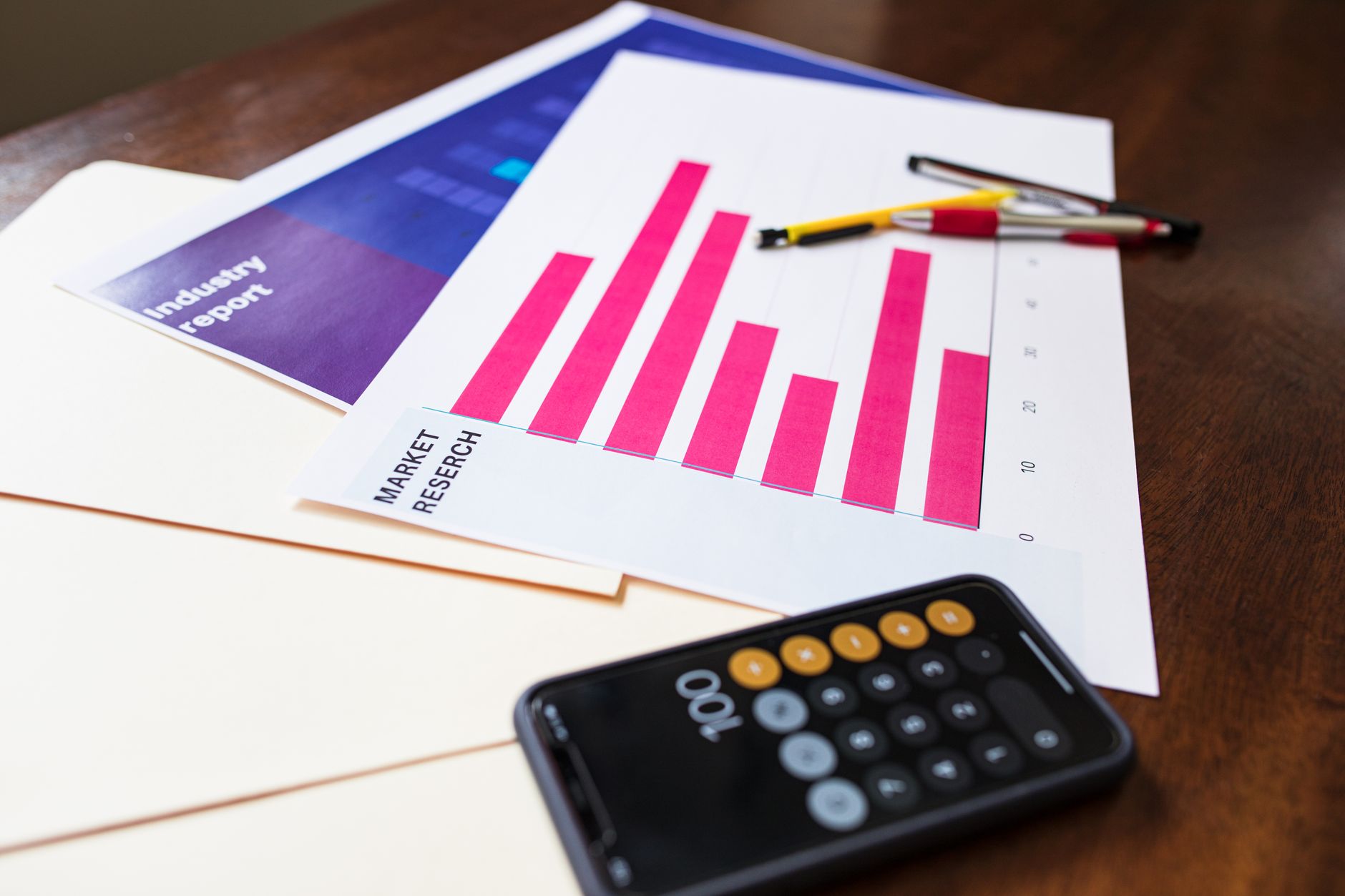 Illustrative market research chart and calculator on wooden desk for business analysis — UPI Study
