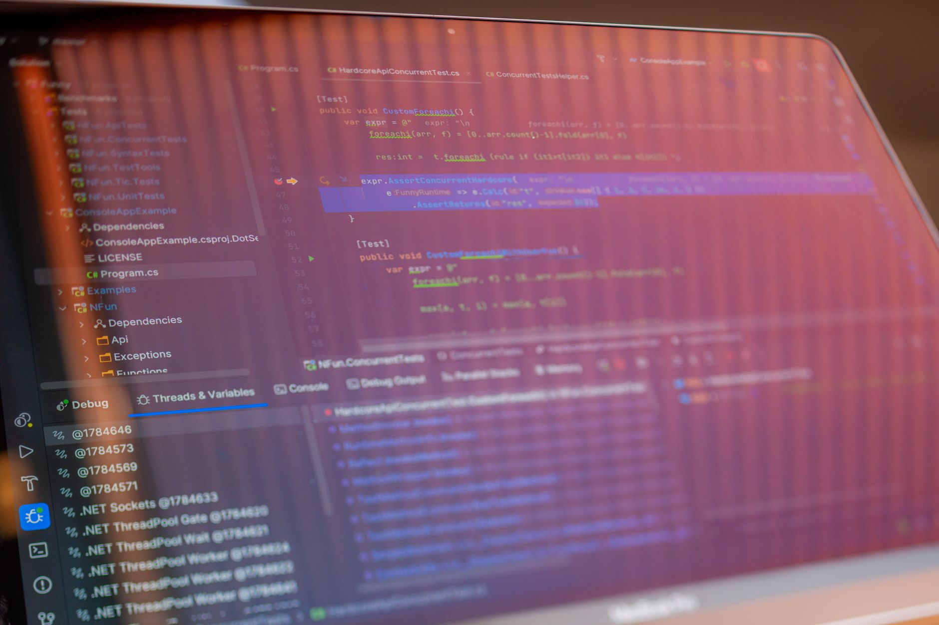 Focused view of a computer screen displaying programming code with visible reflections — UPI Study