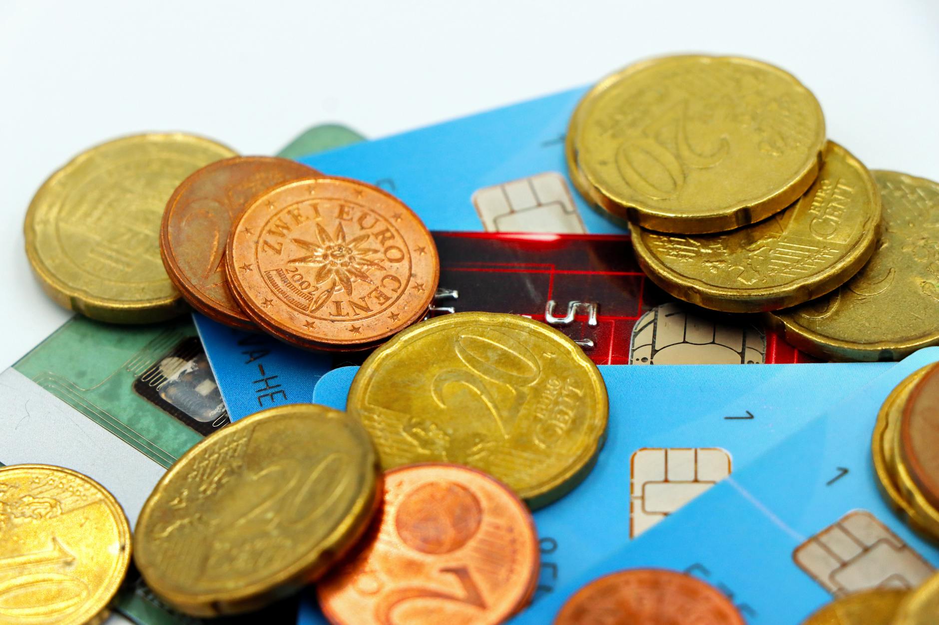 Close-up image of Euro coins and credit cards representing modern financial transactions — UPI Study
